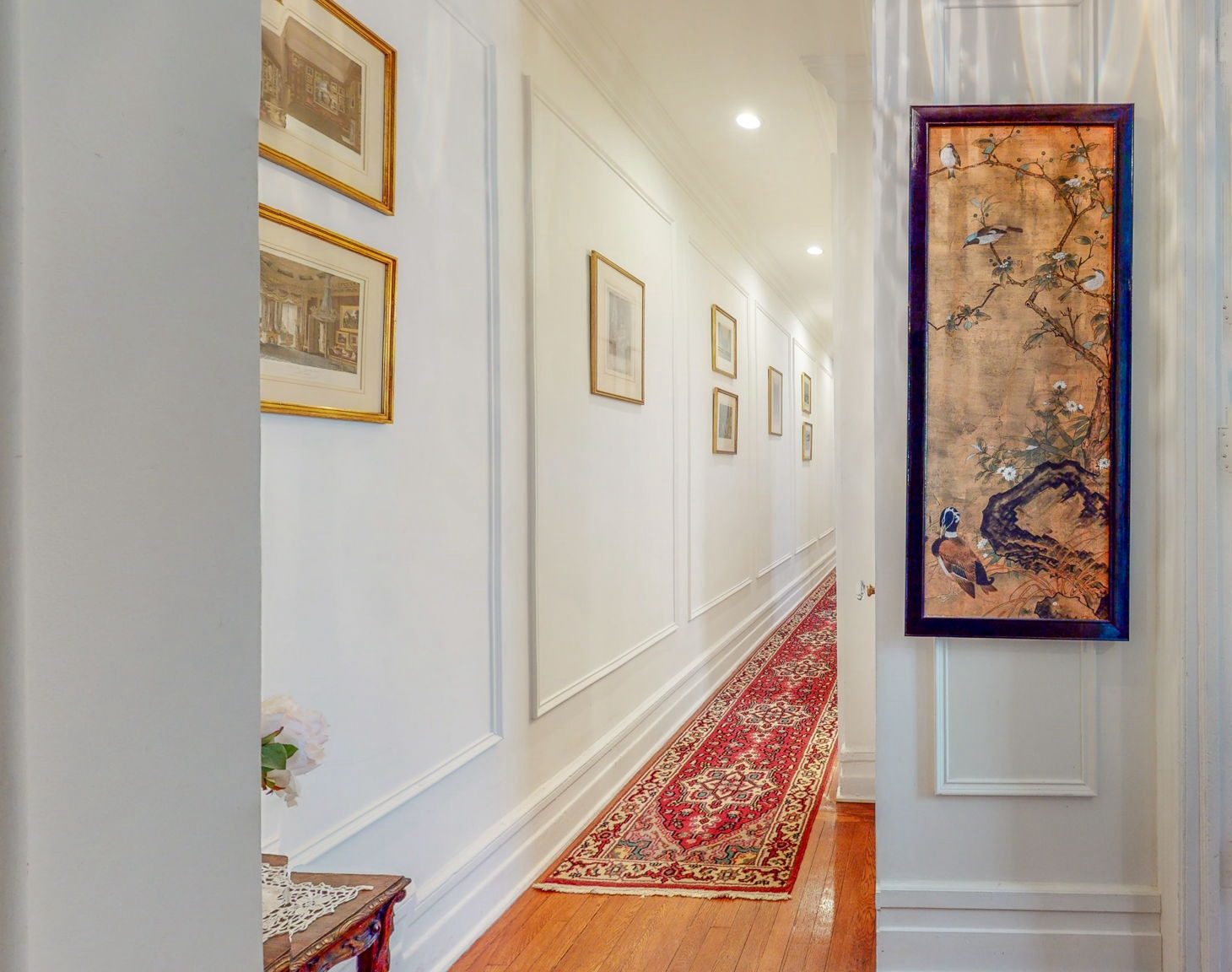 47 Fort Washington Avenue, Unit 55 Manhattan, NY 10032 - Photo 12 of 20 a view of a hallway with paintings on the wall