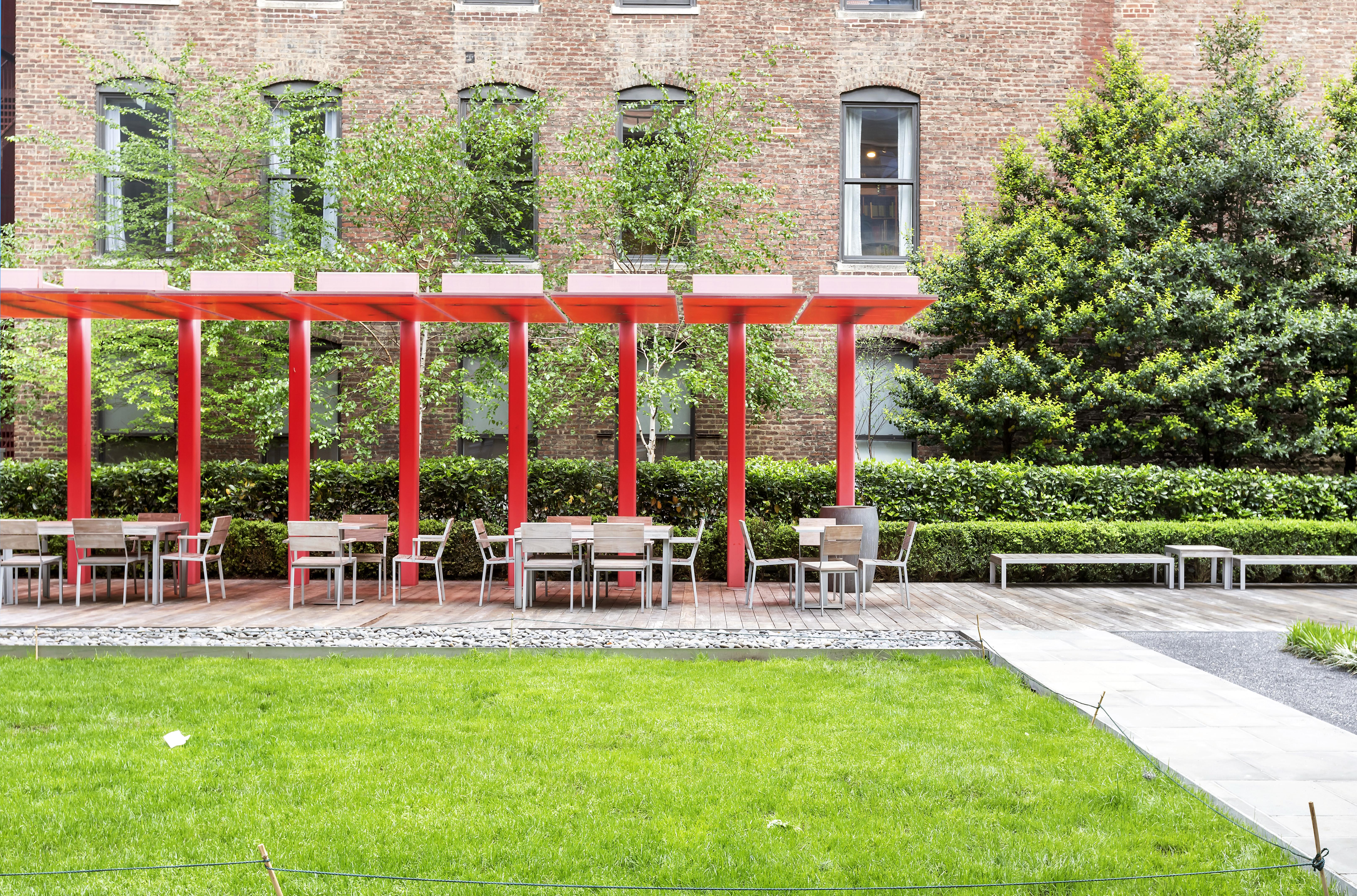 101 West 24th Street, Unit 26A Manhattan, NY 10011 - Photo 20 of 21 a group of chairs sitting in front of a building