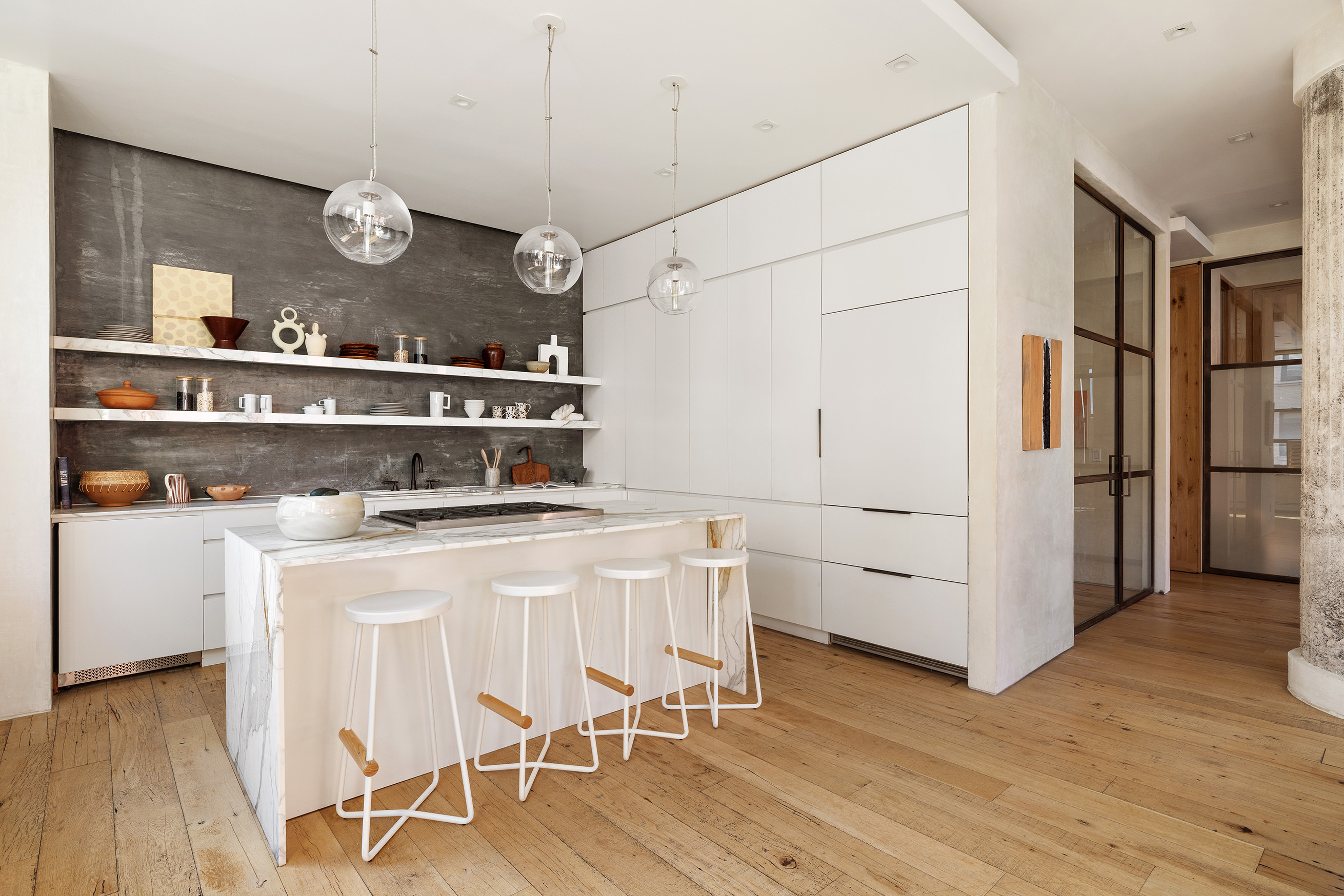 250 Mercer Street, Unit B706B707 Manhattan, NY 10012 - Photo 8 of 25 a kitchen with cabinets and wooden floor