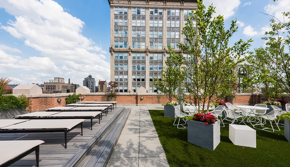 260 Park Avenue South, Unit 9G Manhattan, NY 10010 - Photo 13 of 17 a view of a patio with couches and a potted plant on a table