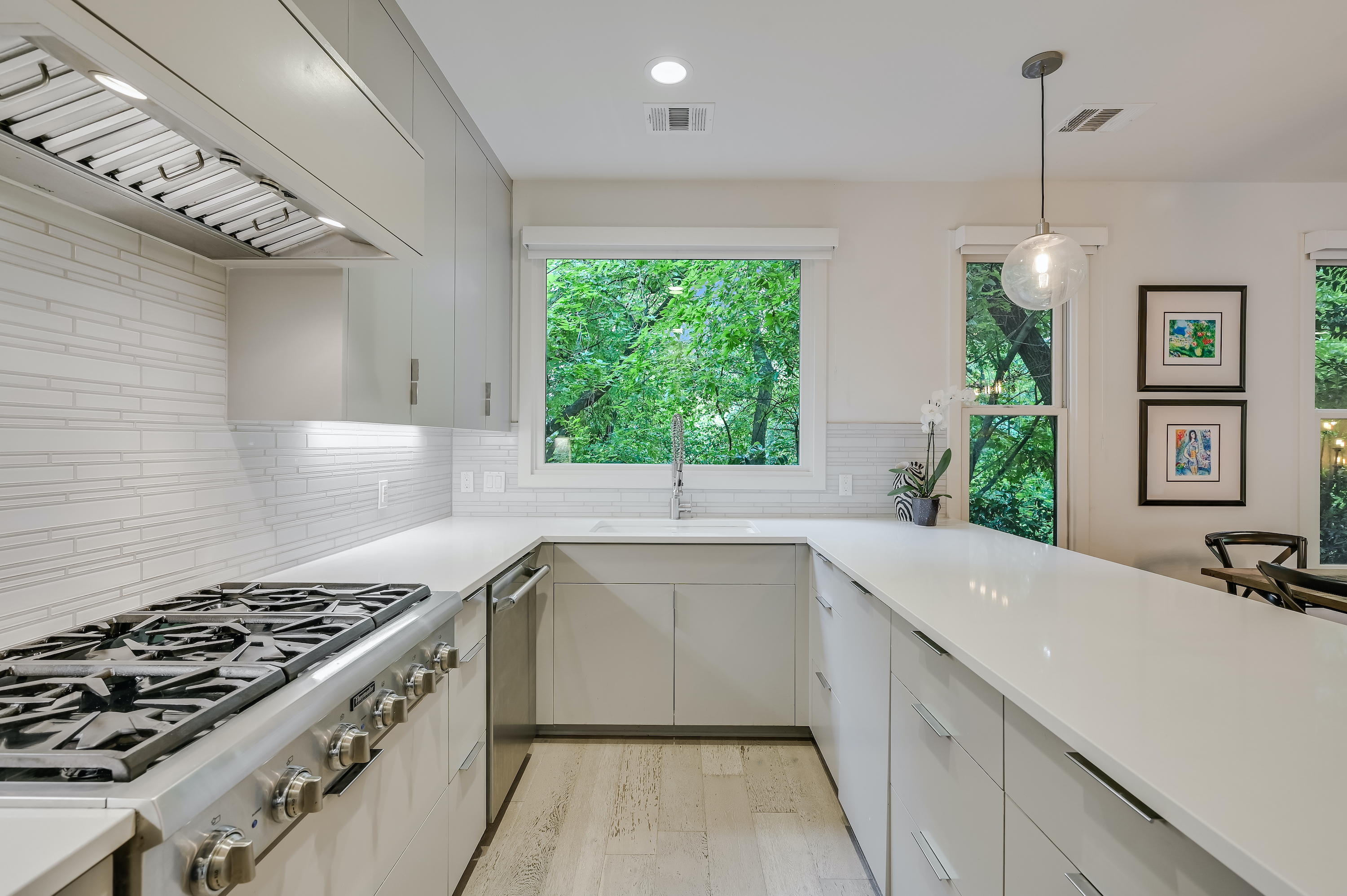 500 South 3rd Street, Unit A Austin, TX 78704 - Photo 10 of 24 a kitchen with a sink stove top oven and cabinets