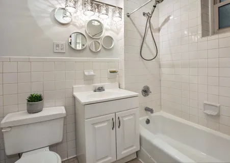 a bathroom with a sink a toilet and a bathtub