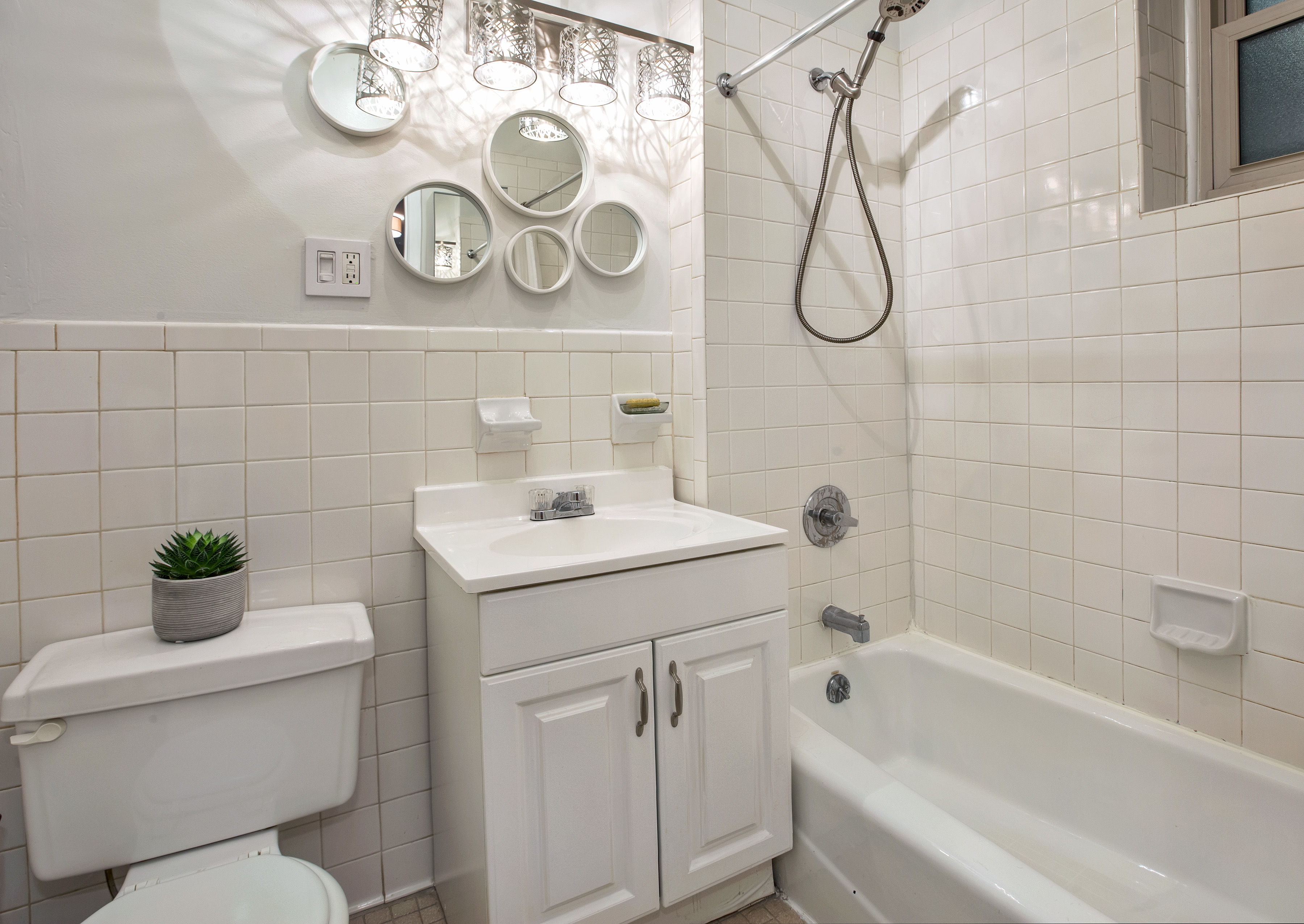 323 West 43rd Street, Unit 1R Manhattan, NY 10036 - Photo 5 of 8 a bathroom with a sink a toilet and a bathtub