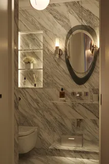 a bedroom with bed and a chandelier