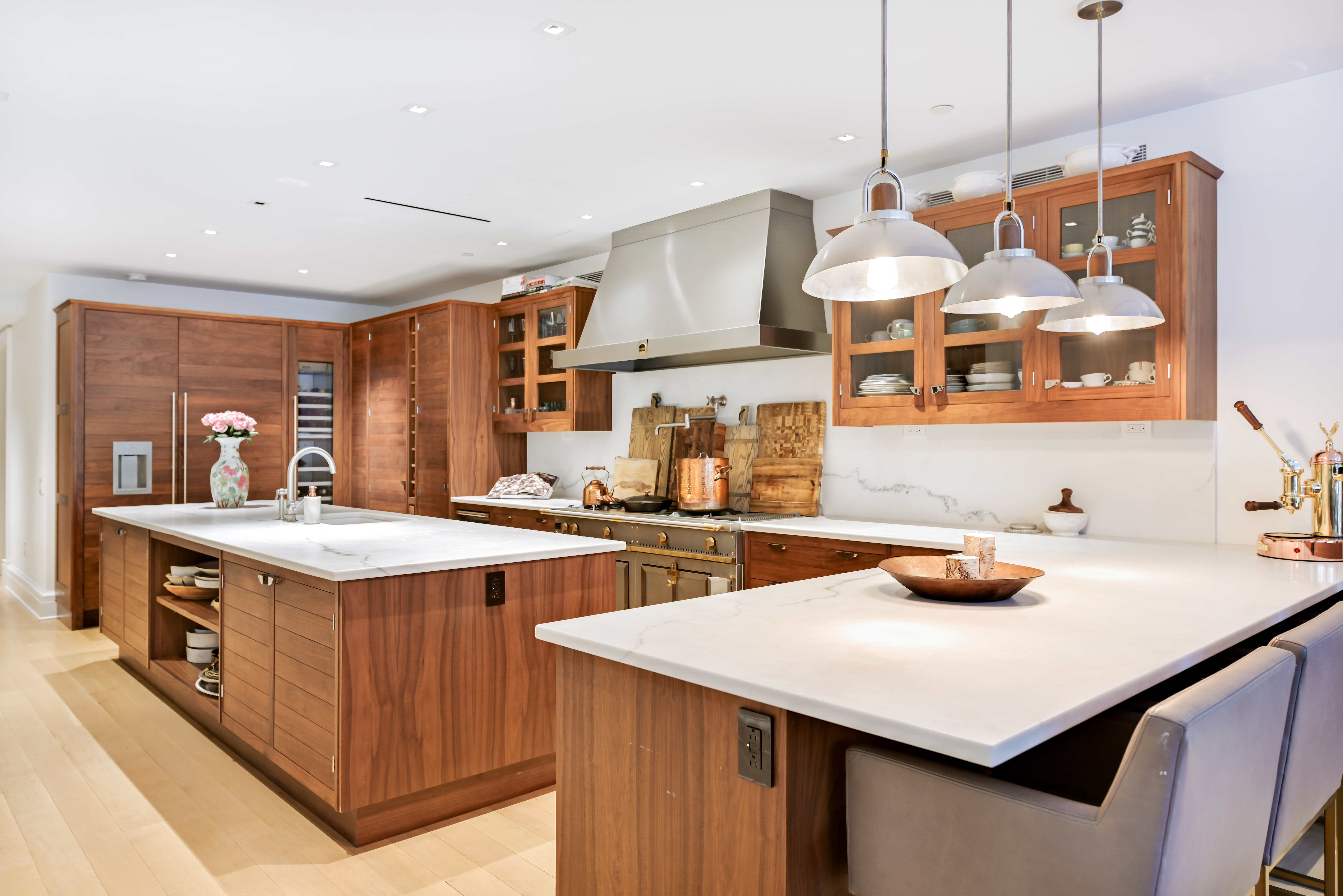 38 Prince Street Manhattan, NY 10012 - Photo 6 of 17 a kitchen with a sink a stove and chairs