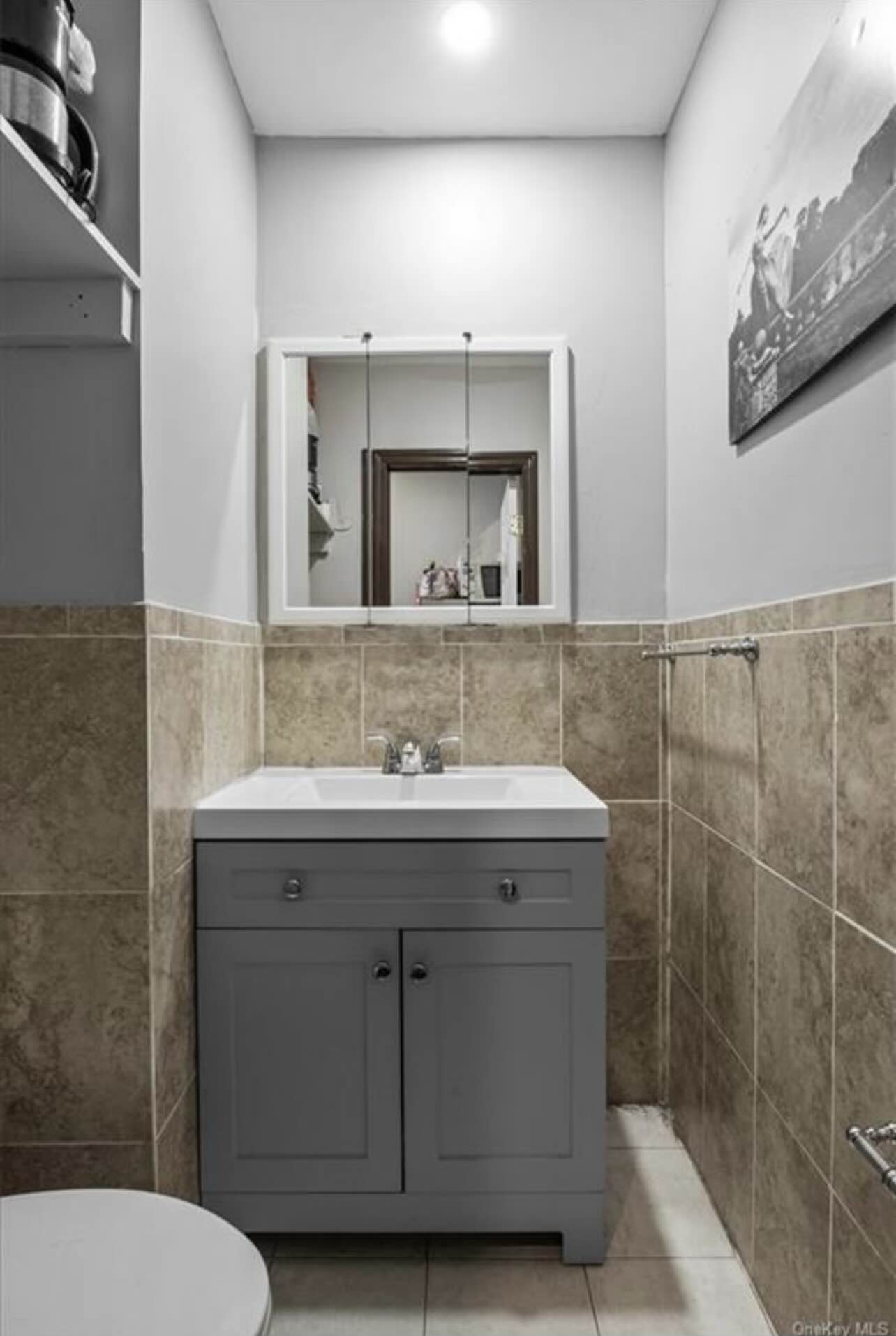 3194 Webster Avenue Bronx, NY 10467 - Photo 16 of 23 a bathroom with a sink toilet and mirror