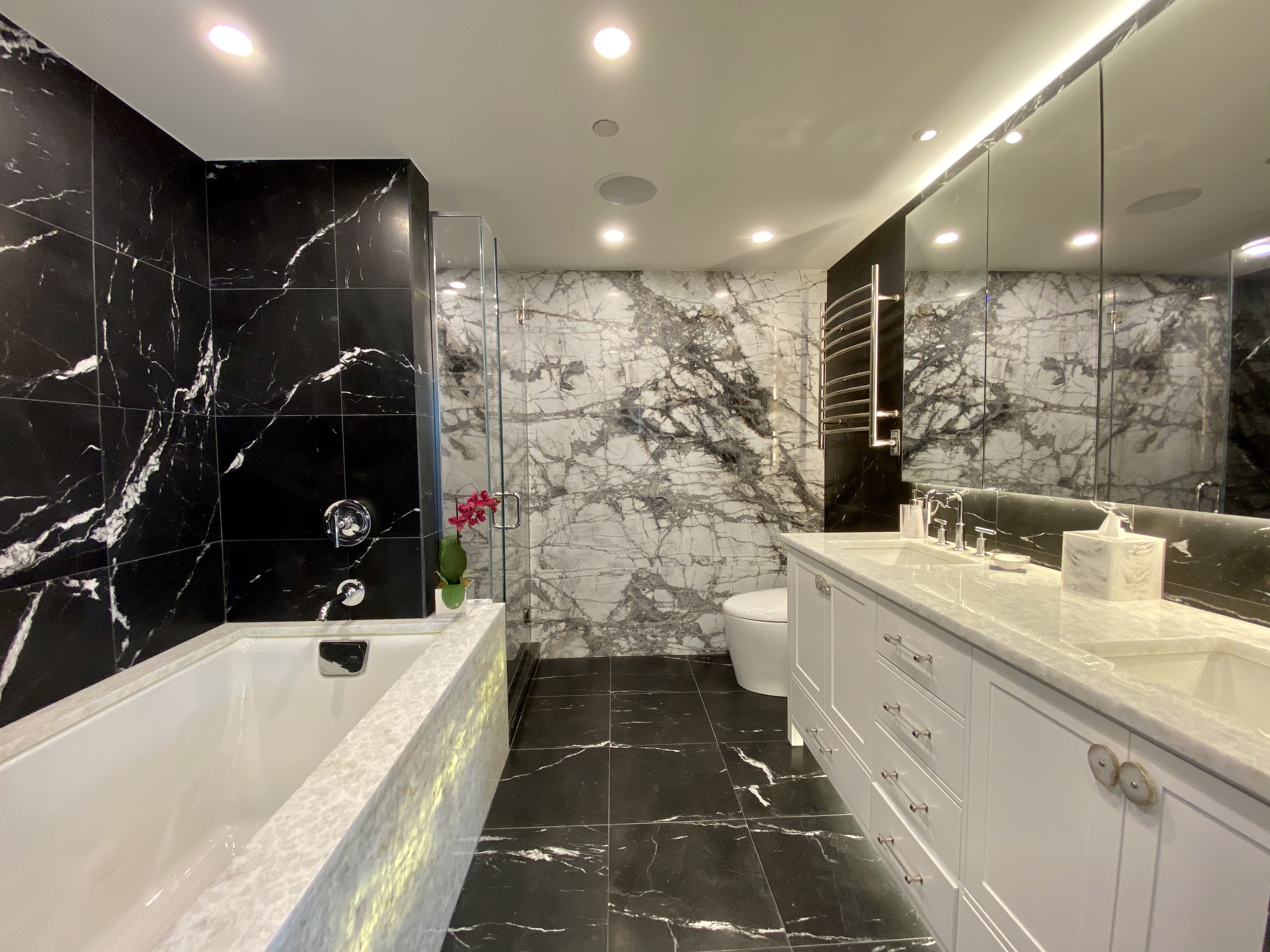 350 West 53rd Street, Unit PHB Manhattan, NY 10019 - Photo 17 of 34 a bathroom with a bathtub a sink and a shower