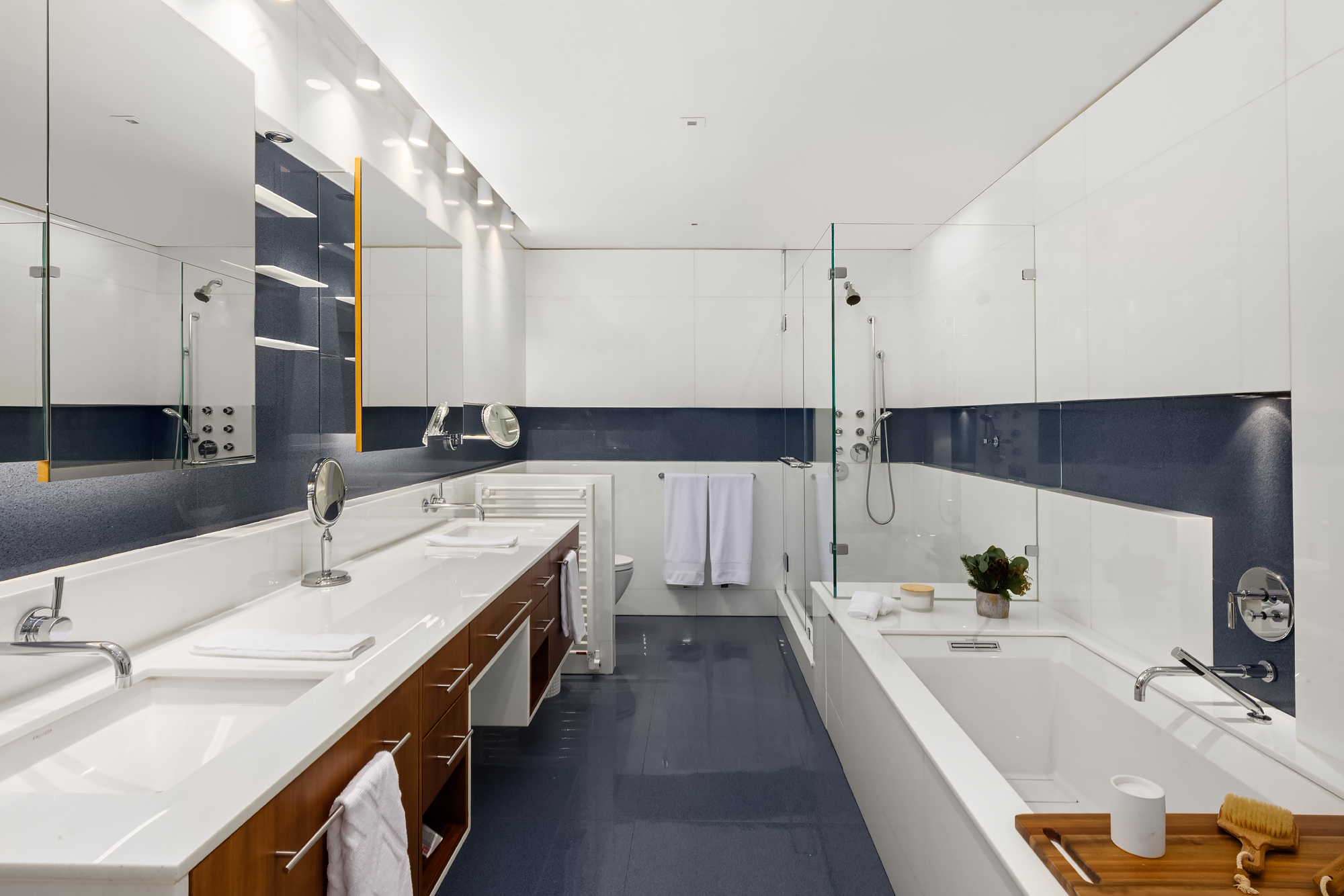 110 Central Park South, Unit 12ABC Manhattan, NY 10019 - Photo 34 of 49 a bathroom with double vanity and a bathtub