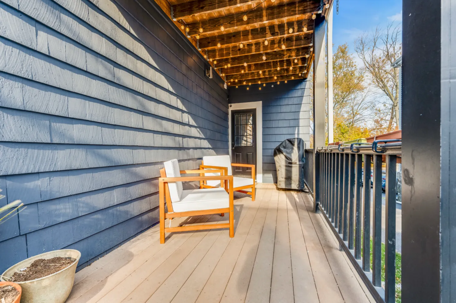 a balcony with view of outdoor space