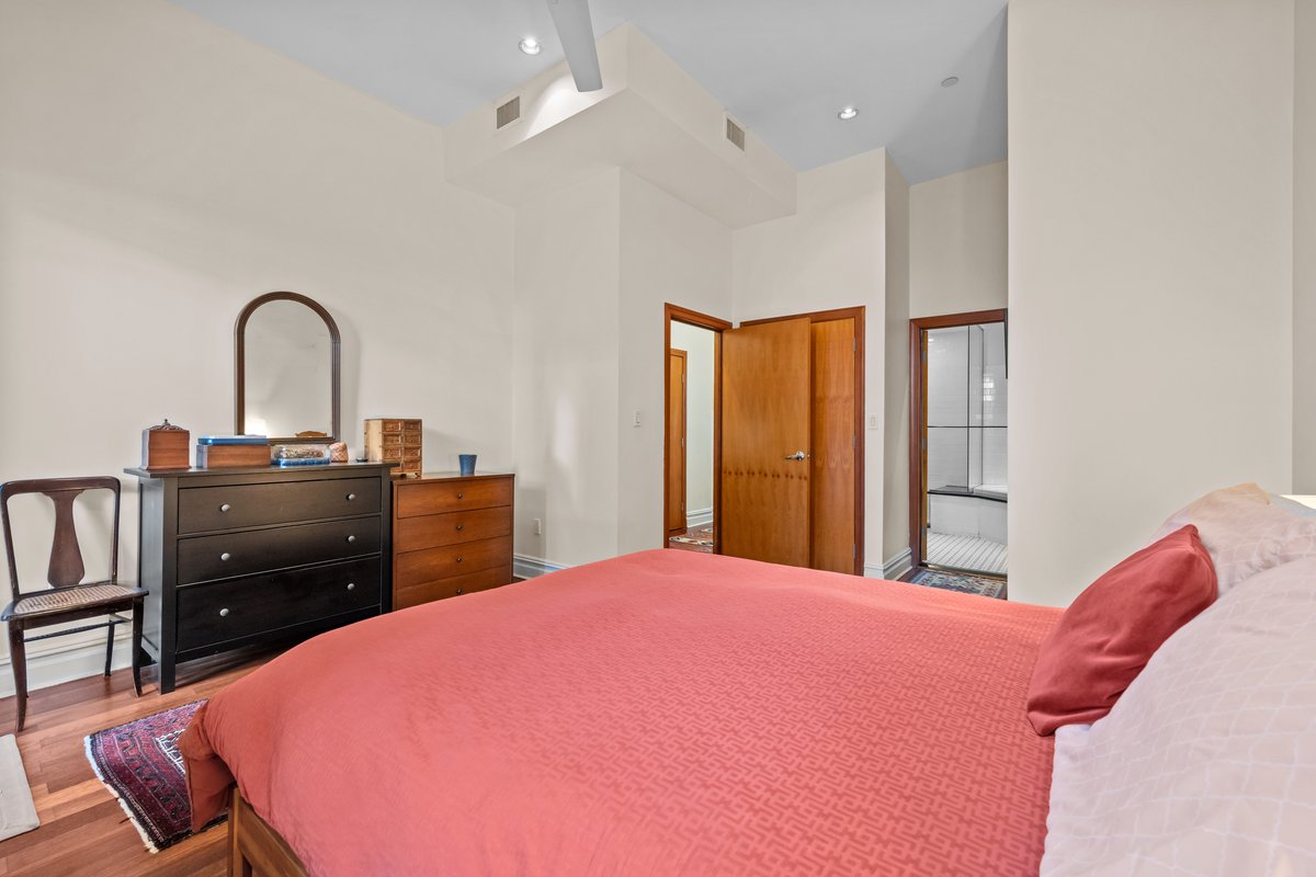 133 West 14th Street, Unit 3 Manhattan, NY 10011 - Photo 6 of 13 a bed room with a bed and a television