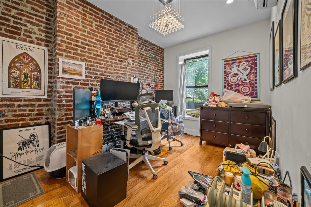 1509 Dean Street, Unit MULTI Brooklyn, NY 11213 - Photo 8 of 12 a room with furniture and a flat screen tv