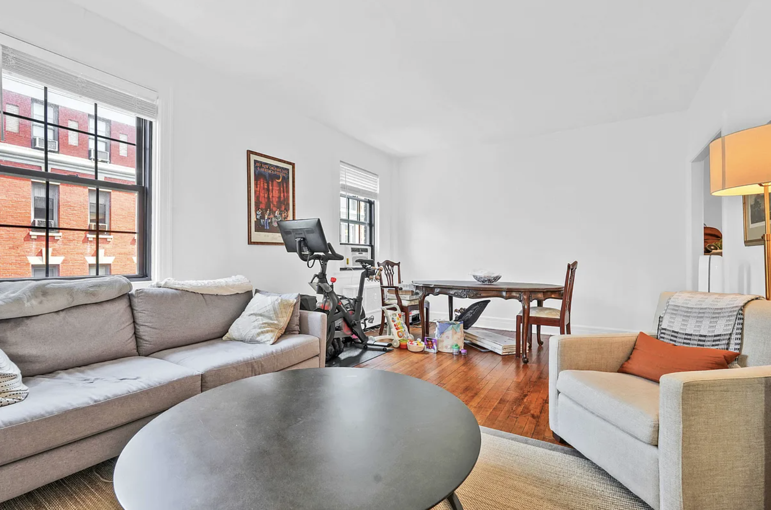 12 Clark Street, Unit 5B Brooklyn, NY 11201 - Photo 2 of 9 a living room with furniture and a floor to ceiling window