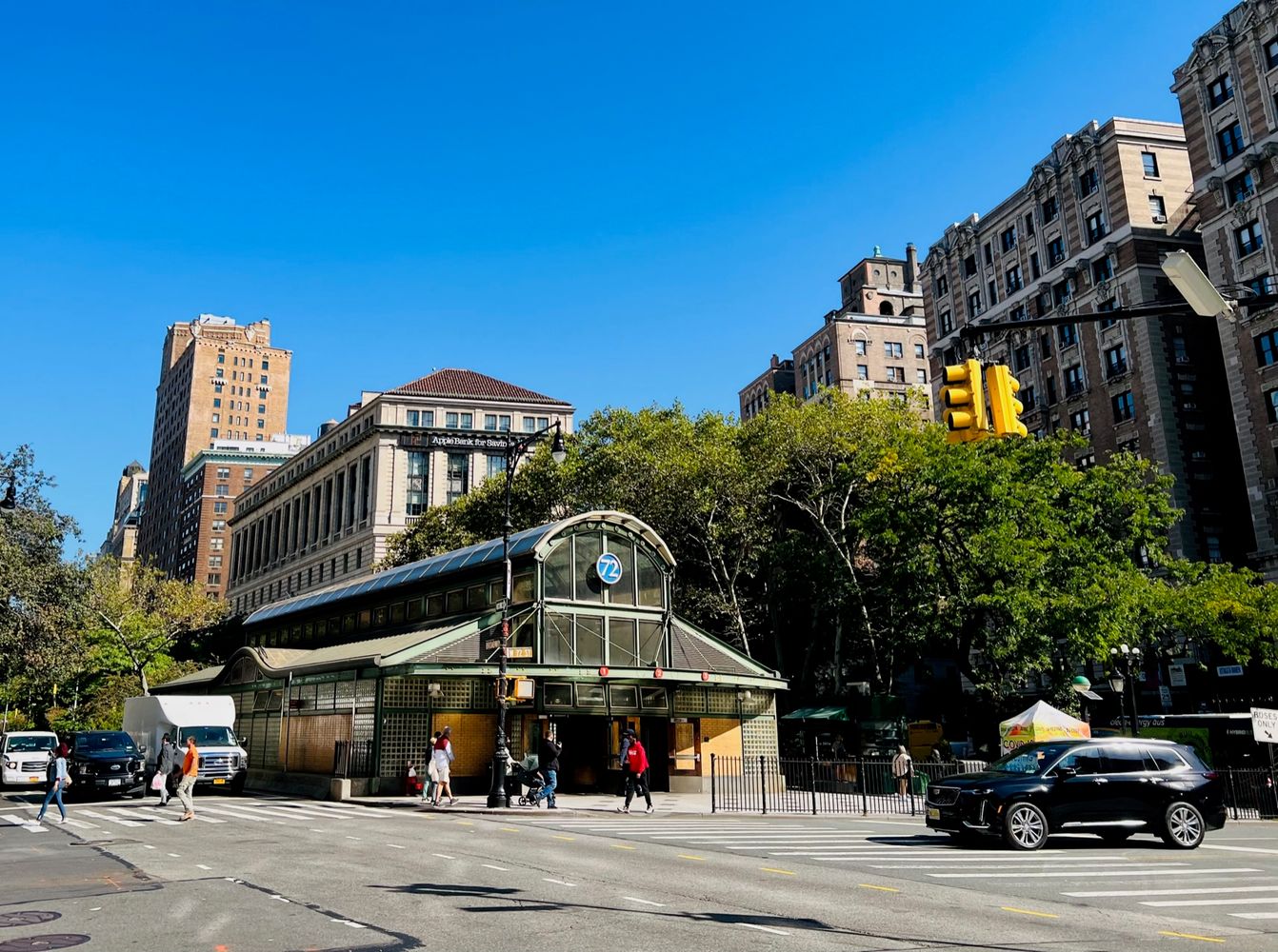 a view of a tall building next to a road