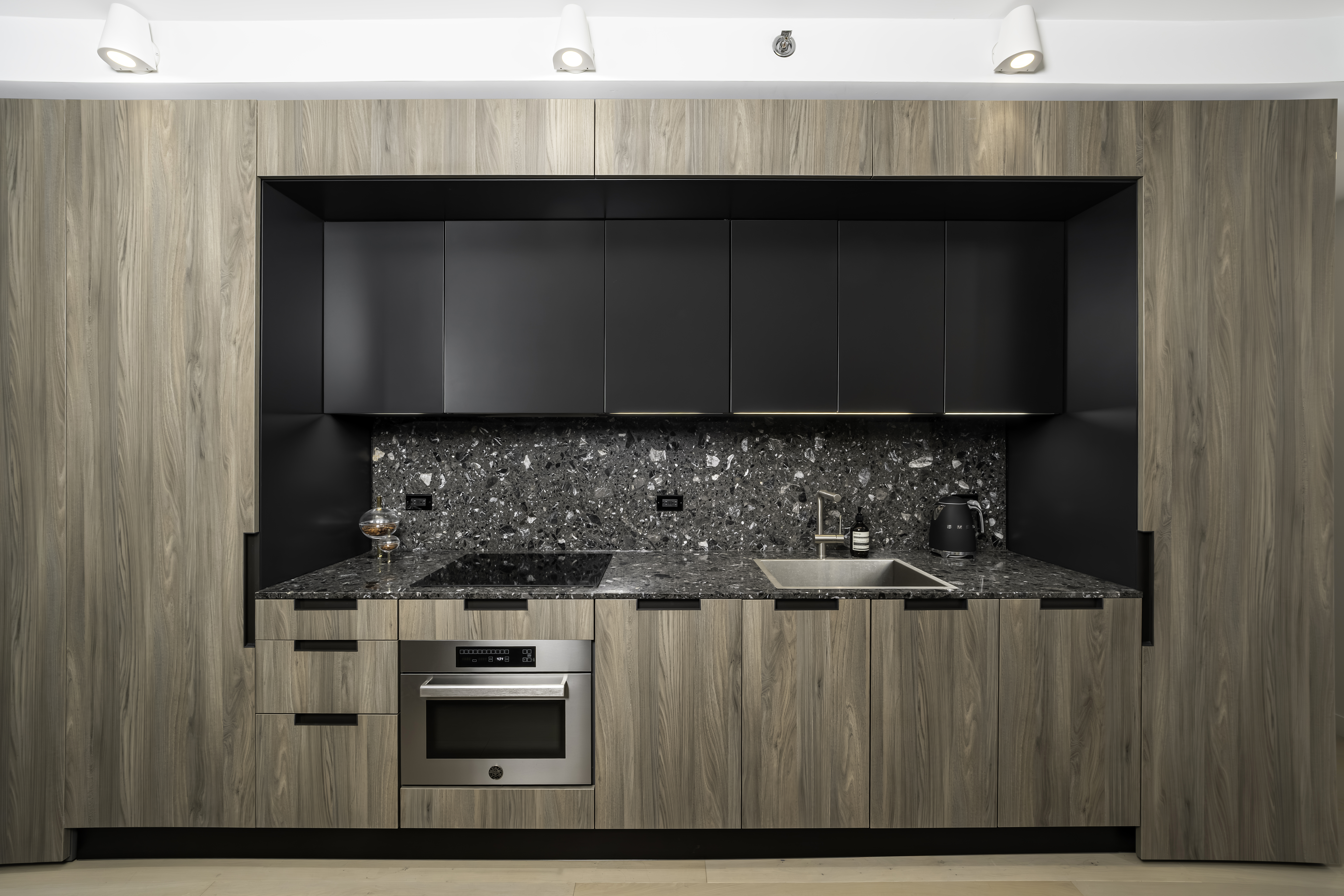 181 East 101st Street, Unit 701 Manhattan, NY 10029 - Photo 3 of 16 a kitchen with a stove and a microwave
