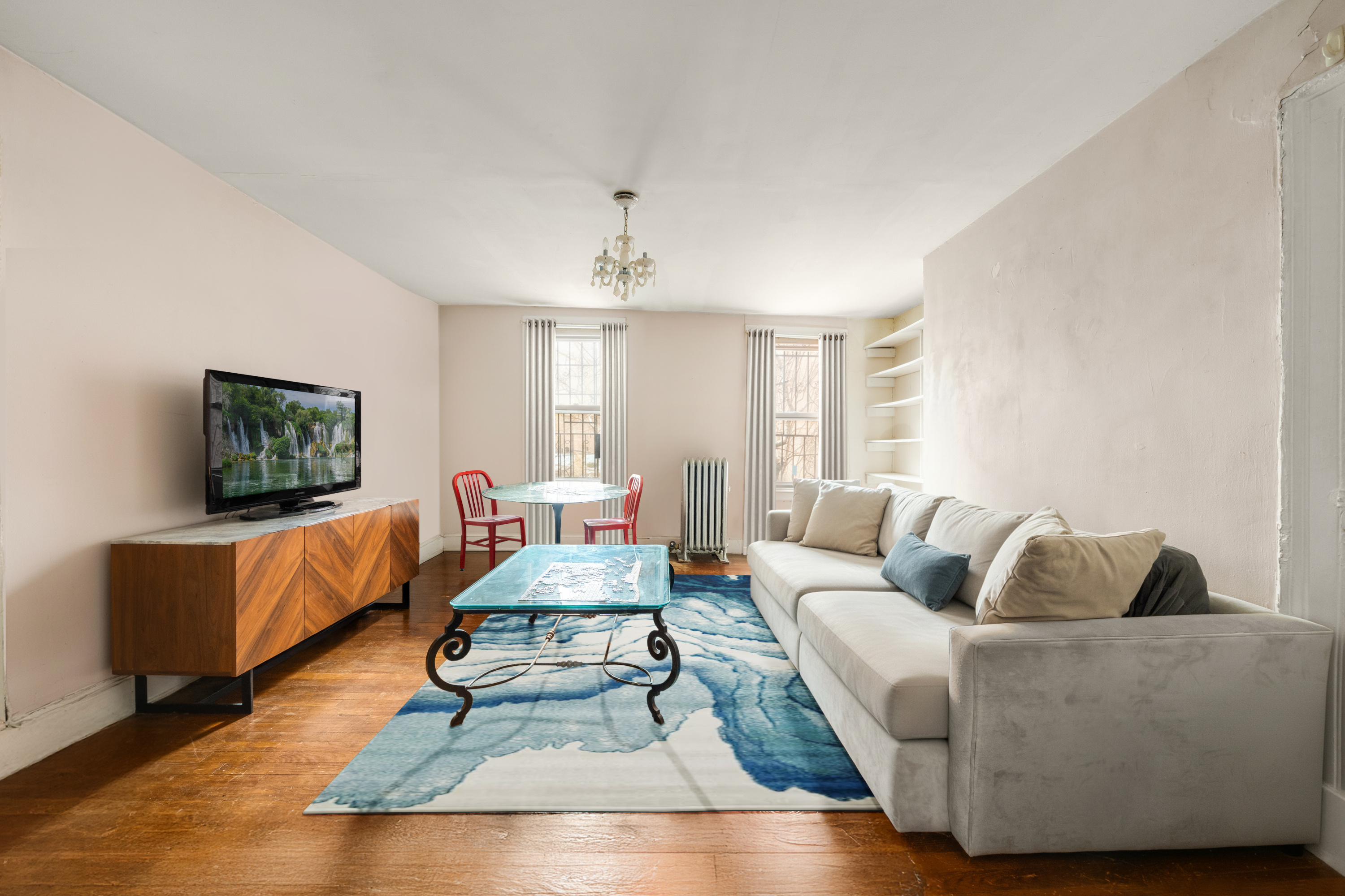 446 State Street Brooklyn, NY 11217 - Photo 11 of 23 a living room with furniture and a flat screen tv