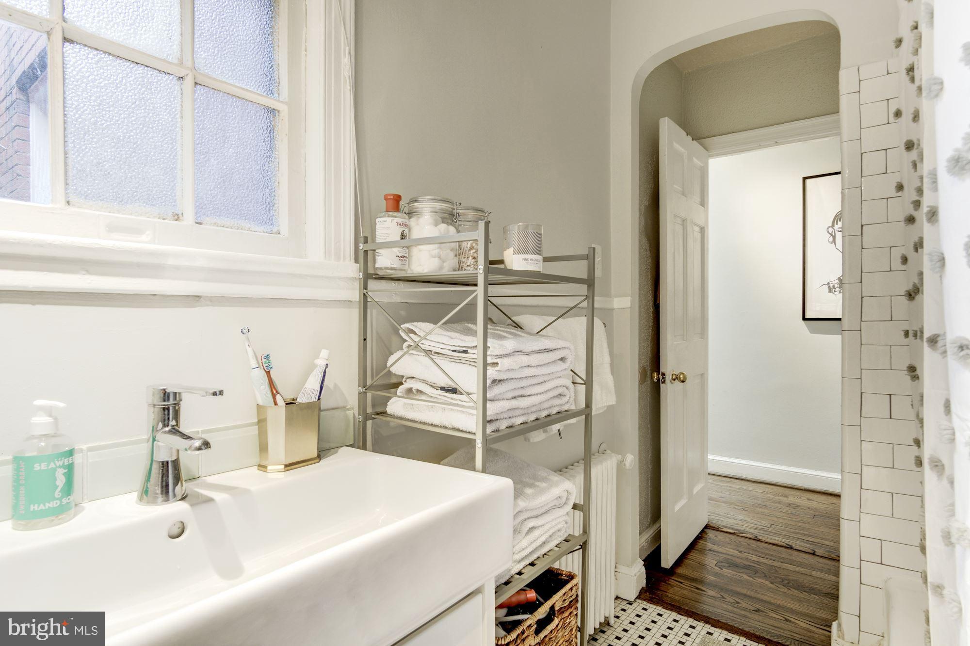 731 13th Street Northeast Washington, DC 20002 - Photo 25 of 43 a bathroom with a sink and a shower