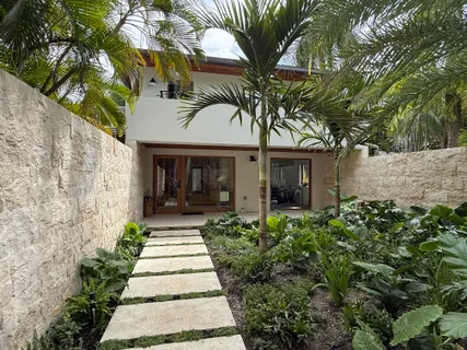 front view of a house with a garden