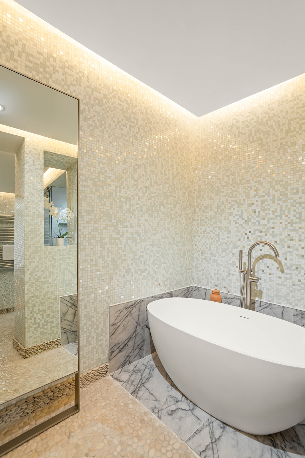 244 West 23rd Street, Unit 3A Manhattan, NY 10011 - Photo 10 of 11 a white bath tub sitting next to a bathroom