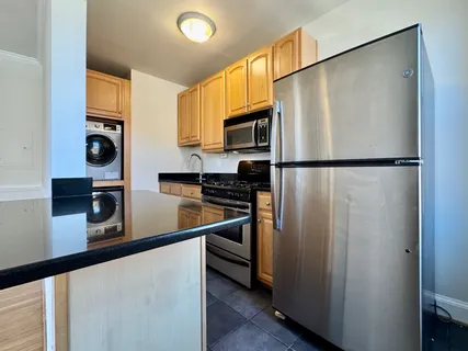 a white refrigerator freezer sitting in a kitchen