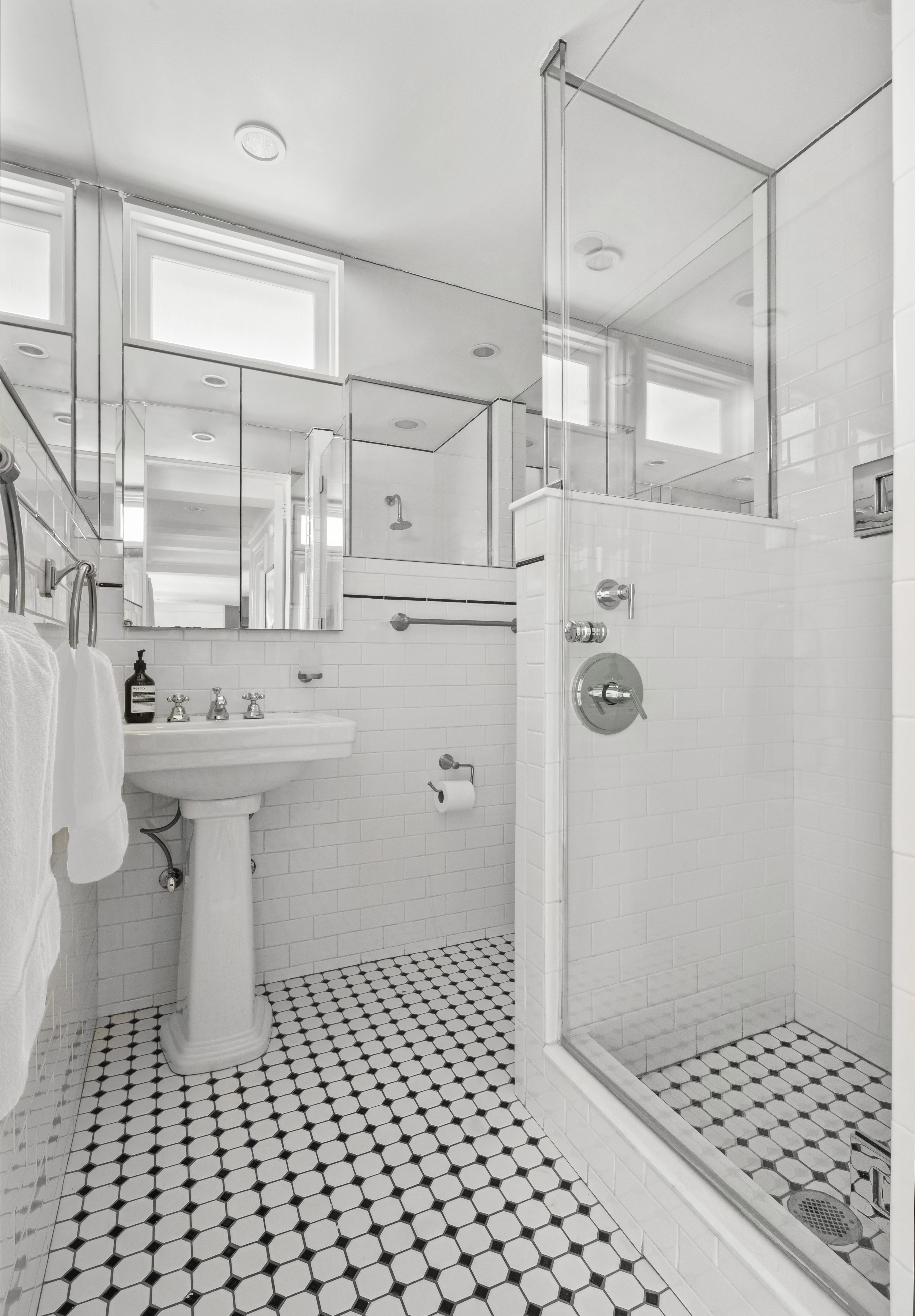 170 2nd Avenue, Unit 4A Manhattan, NY 10003 - Photo 7 of 11 a bathroom with a sink a toilet and shower
