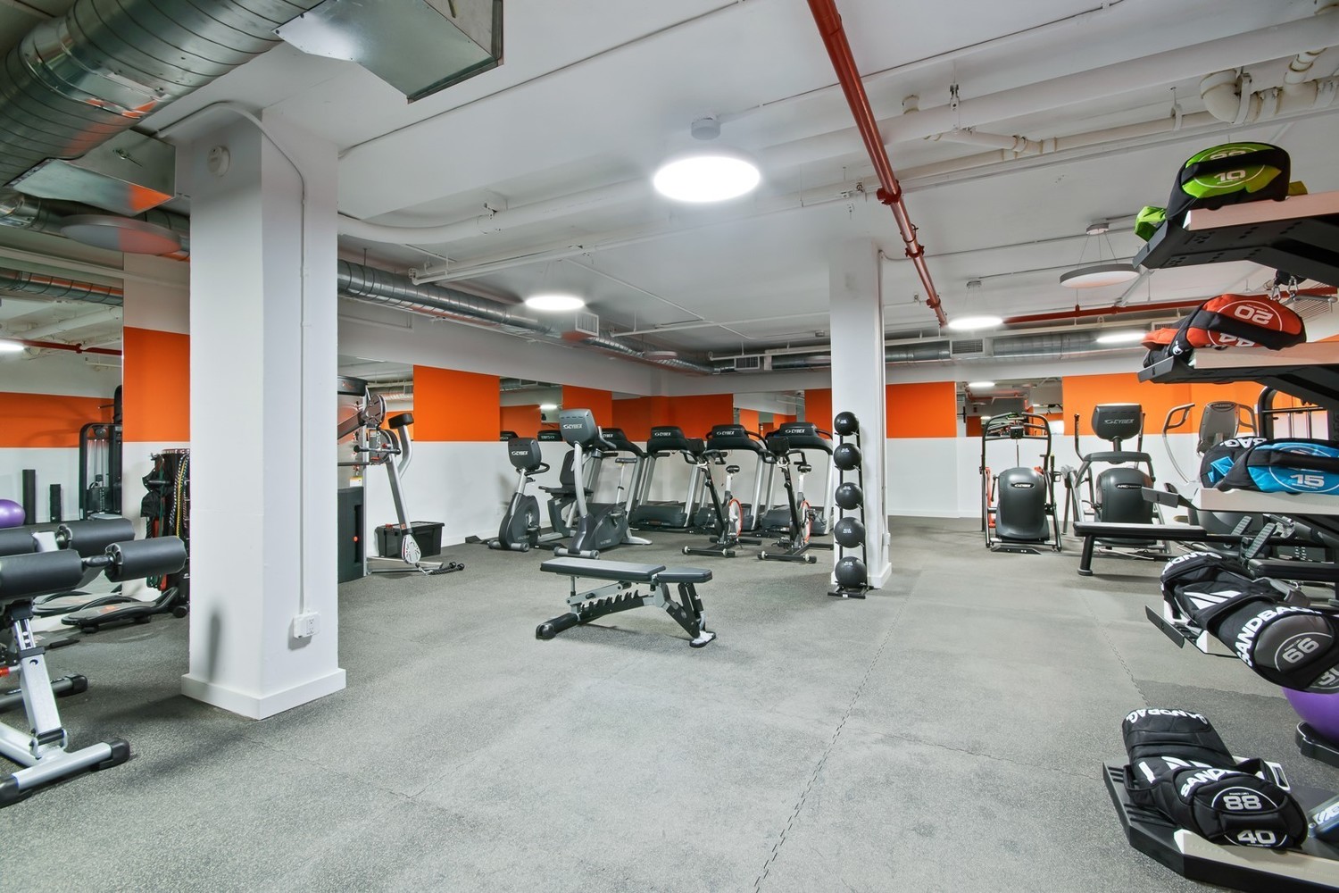 385 1st Avenue, Unit 4B Manhattan, NY 10010 - Photo 13 of 18 a view of a room with gym equipment