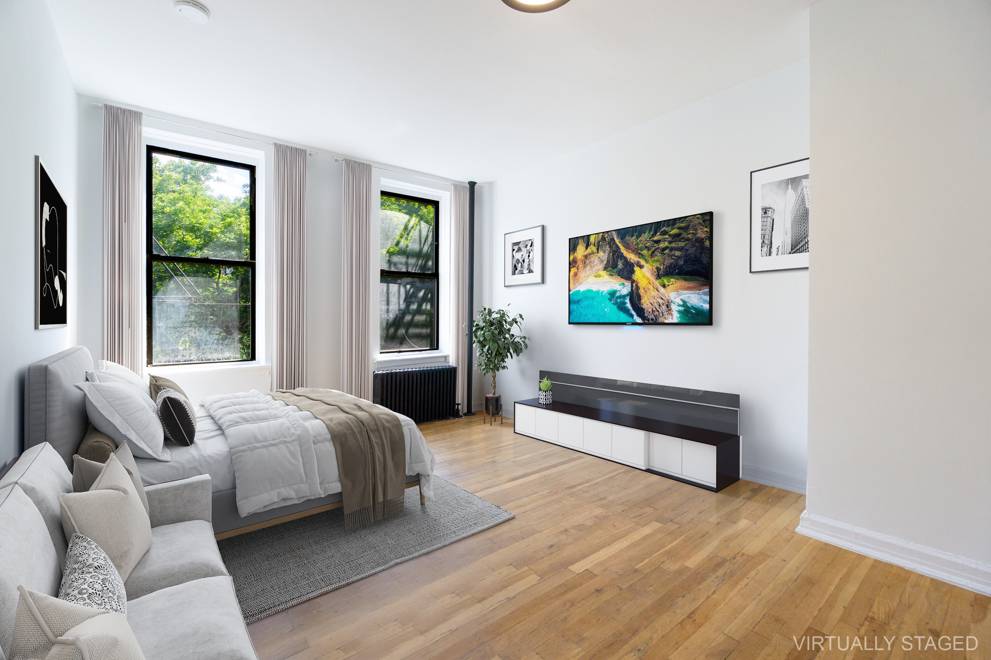 a bedroom with a bed and a flat screen tv