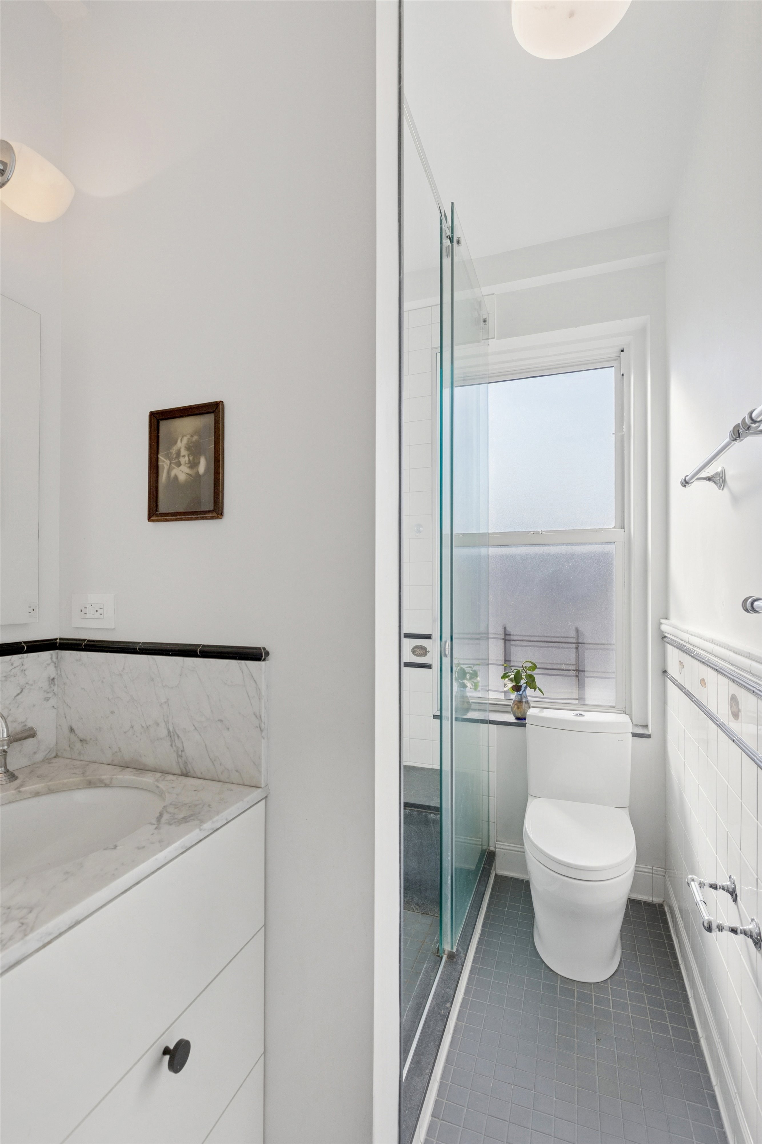 127 West 82nd Street, Unit 8A Manhattan, NY 10024 - Photo 11 of 15 a bathroom with a toilet sink and a shower