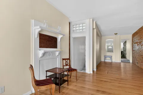 a view of a livingroom with furniture and a fireplace