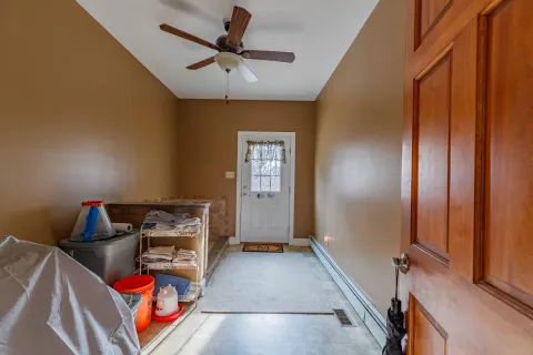 a bathroom with granite countertop a sink and a bathtub