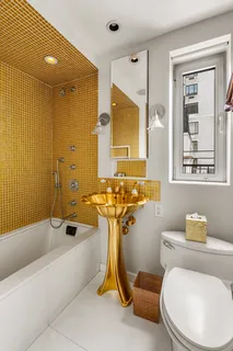a bathroom with a sink mirror bathtub and toilet