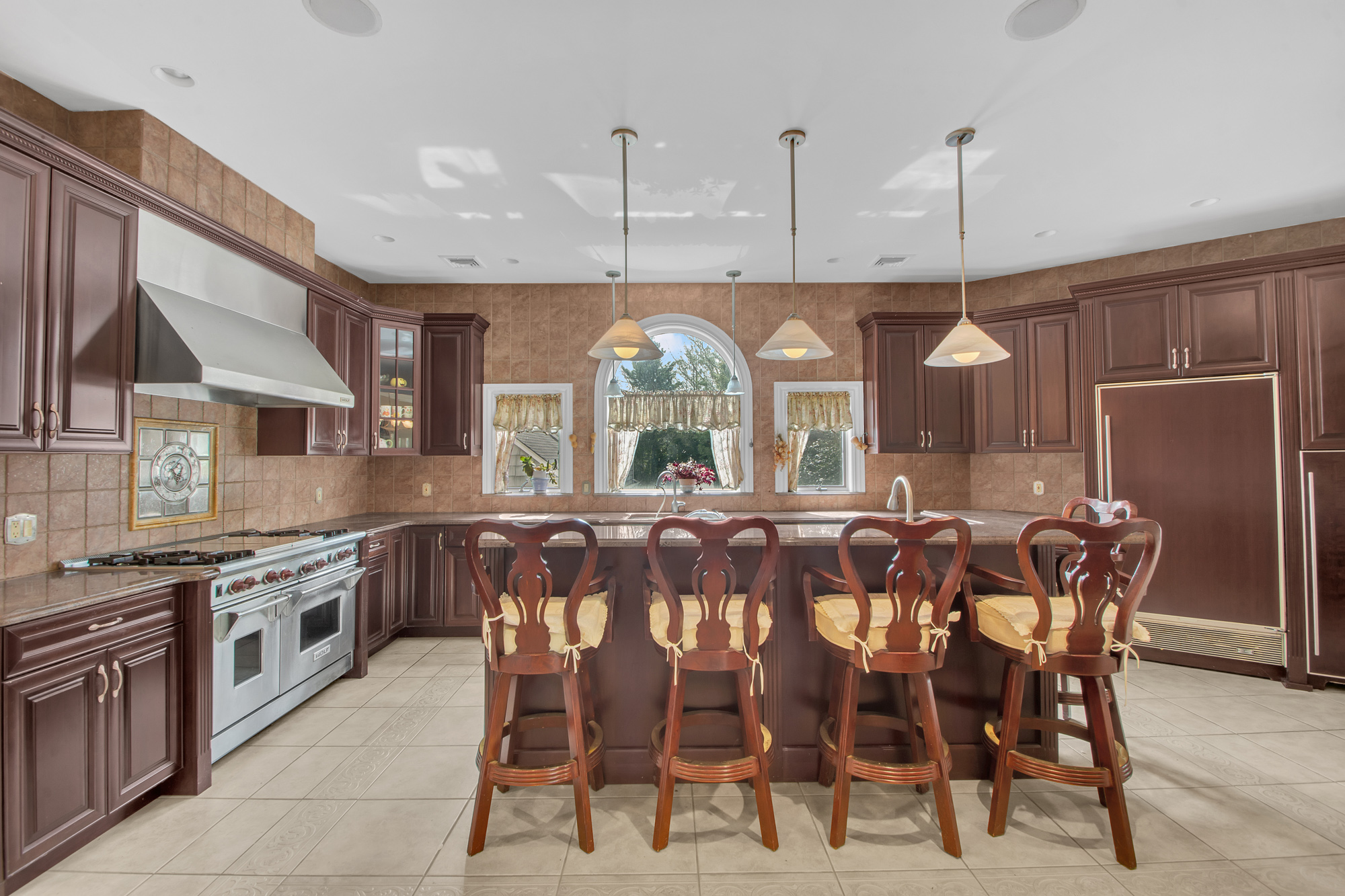 68 Circle Road Staten Island, NY 10304 - Photo 8 of 38 a large kitchen with a table and chairs