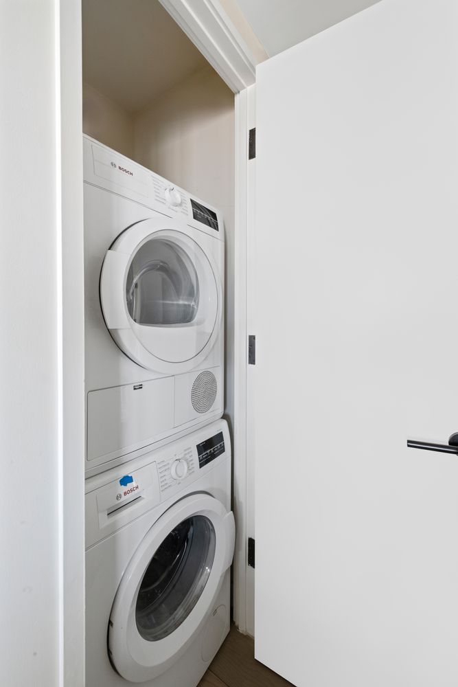175 West 95th Street, Unit 19F Manhattan, NY 10025 - Photo 11 of 16 a utility room with dryer and washer