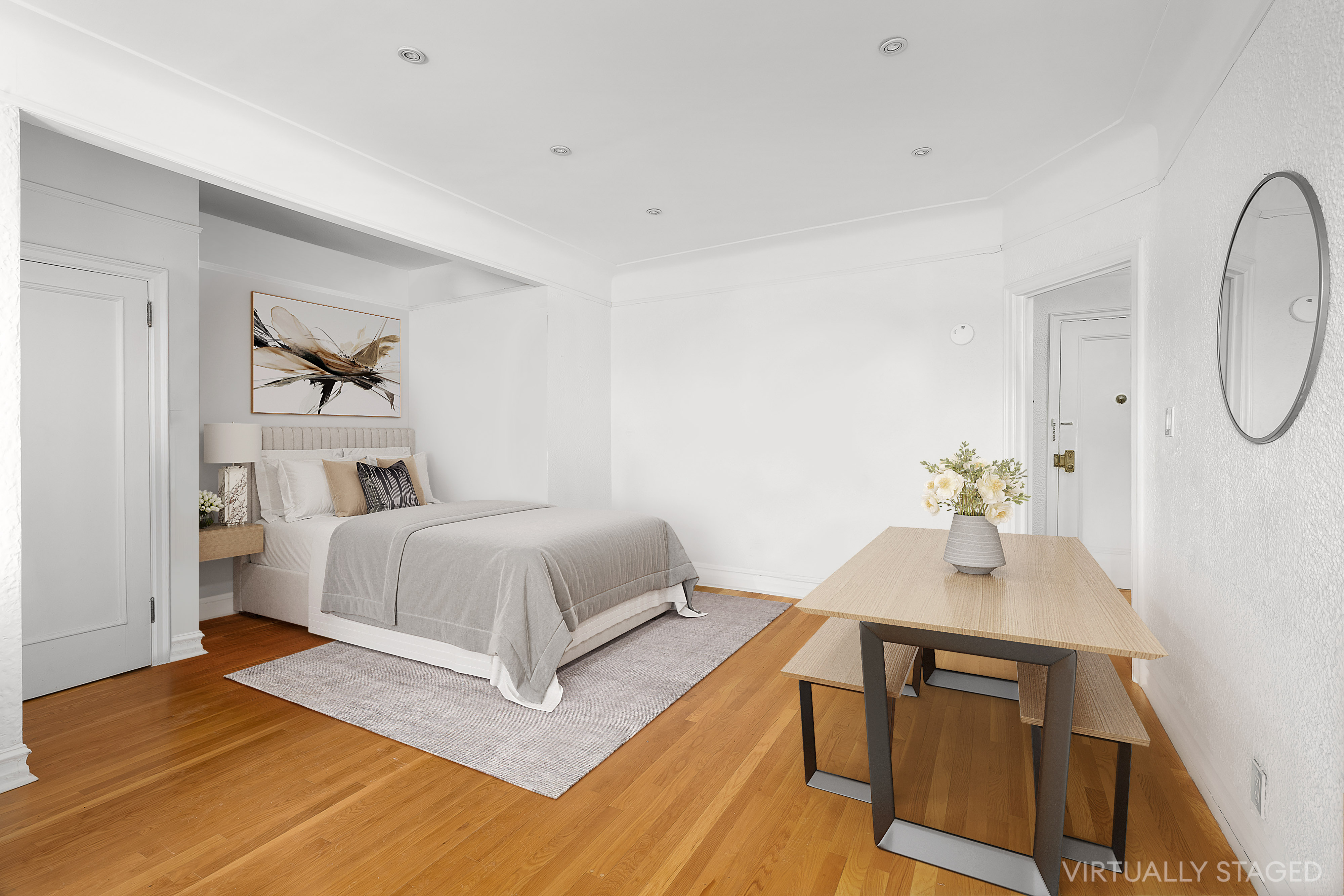 451 Clinton Avenue, Unit 3D Brooklyn, NY 11238 - Photo 4 of 8 a bedroom with a bed and a potted plant