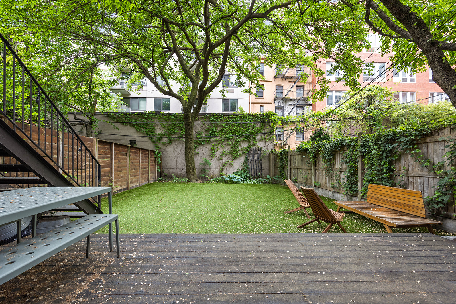 298 State Street, Unit TRIPLEX Brooklyn, NY 11201 - Photo 19 of 21 a small garden covered with tall trees