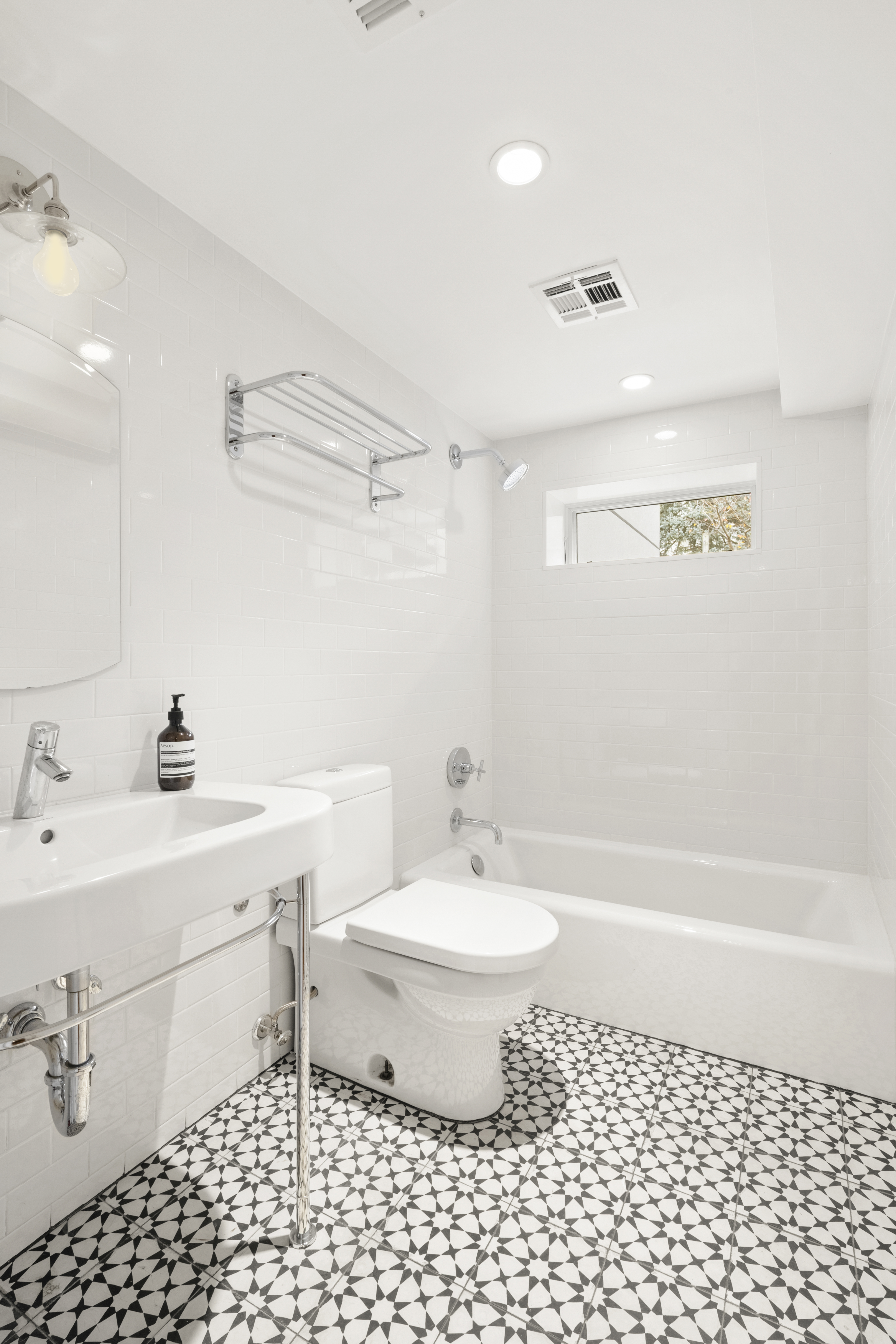 203 Huntington Street Brooklyn, NY 11231 - Photo 8 of 16 a bathroom with a sink a toilet and shower