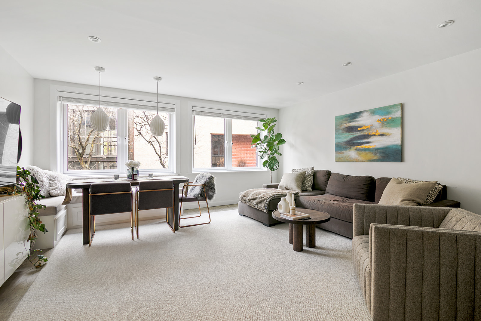 712 Washington Street, Unit 2A Manhattan, NY 10014 - Photo 1 of 8 a living room with furniture and a large window