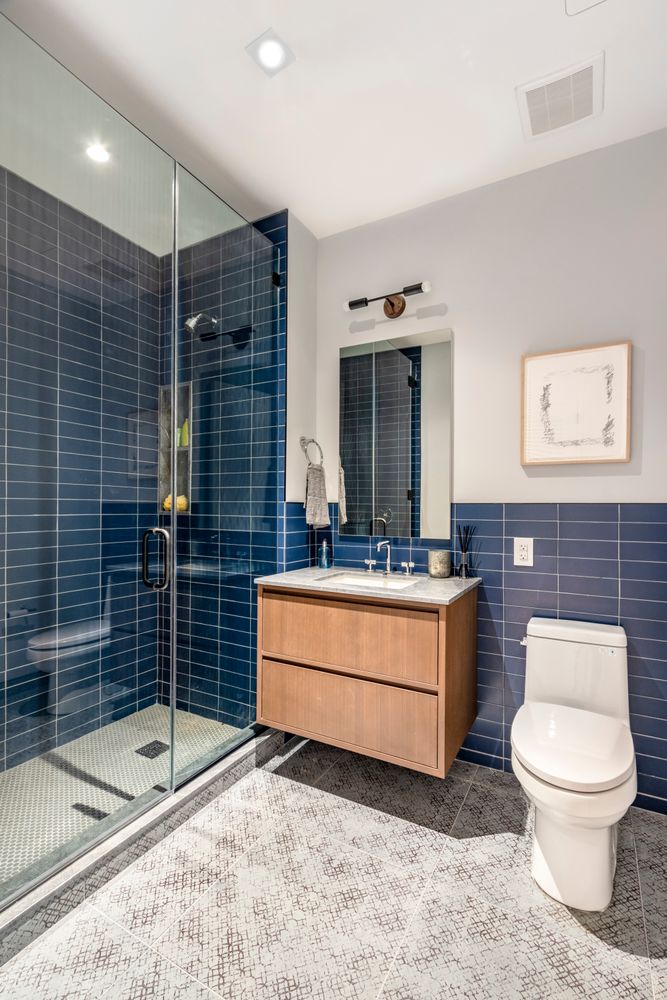 106 Franklin Street, Unit 2 Manhattan, NY 10013 - Photo 10 of 16 a bathroom with a toilet a sink and mirror