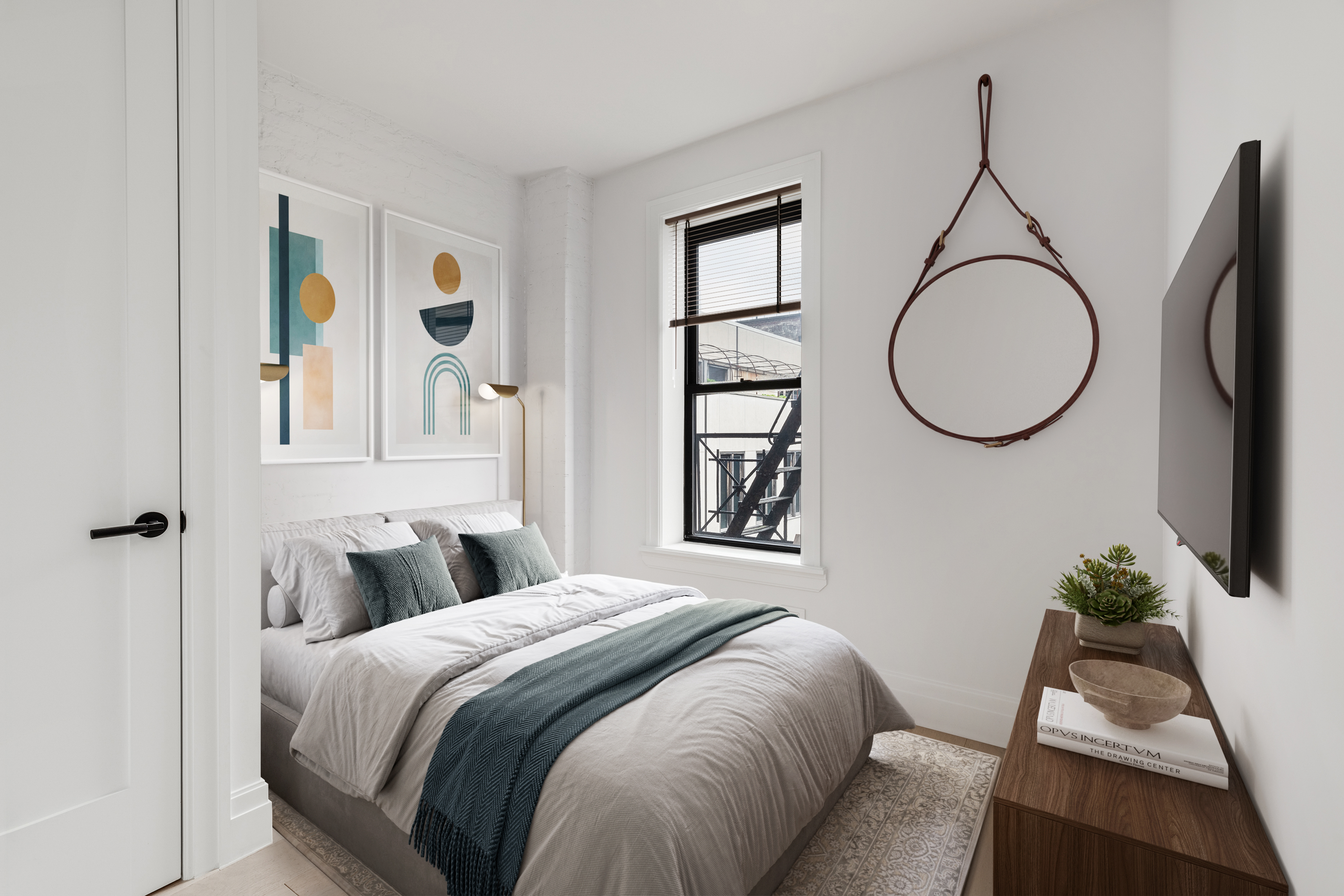 14 Bedford Street, Unit 19 Manhattan, NY 10014 - Photo 3 of 5 a bedroom with a bed and a chandelier