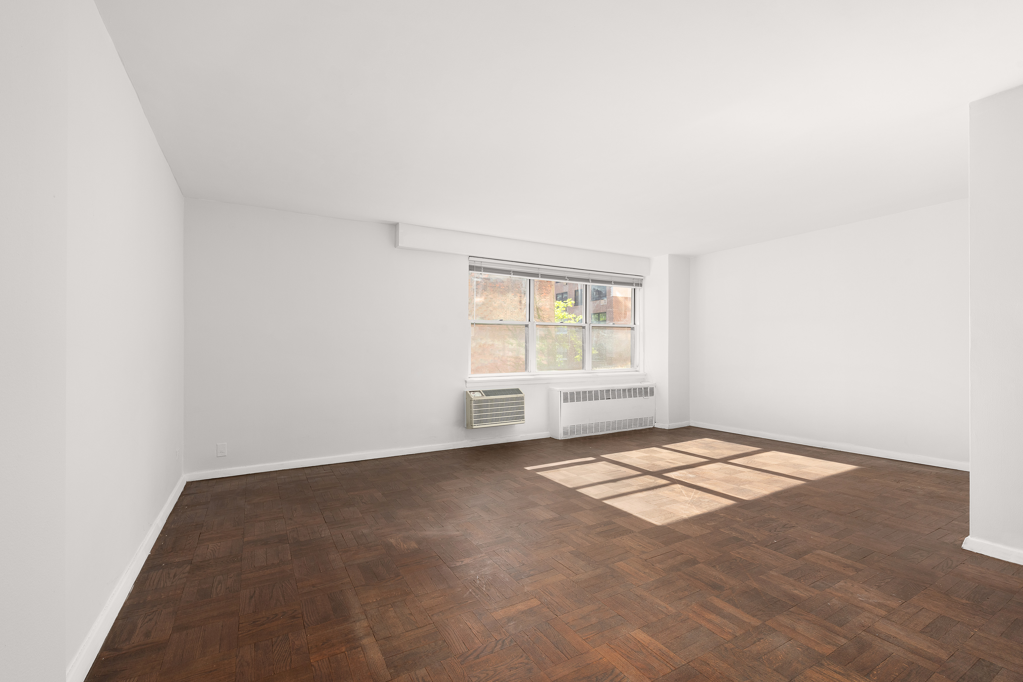 300 East 71st Street, Unit 5S Manhattan, NY 10021 - Photo 2 of 7 an empty room with windows