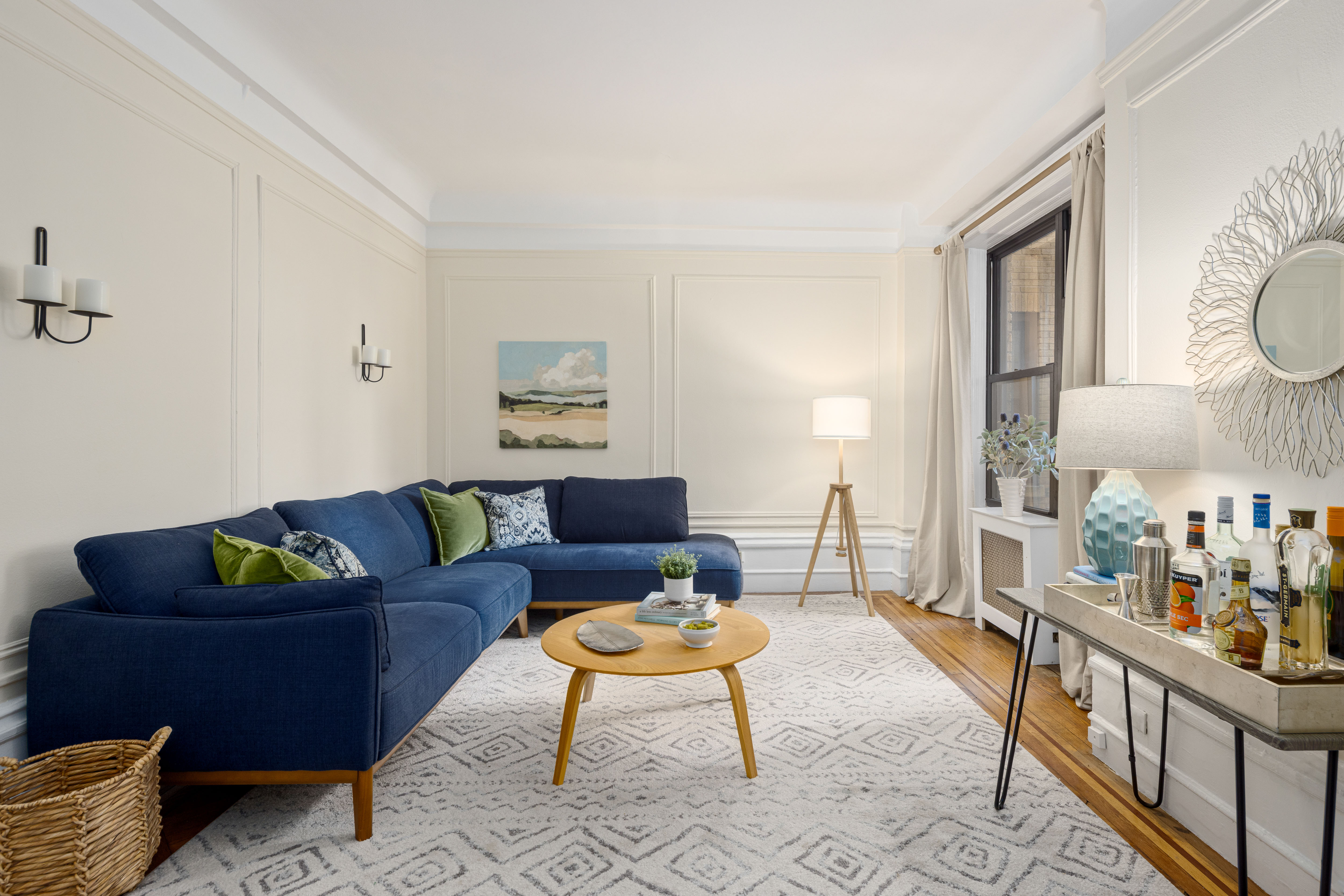 a living room with furniture and a rug
