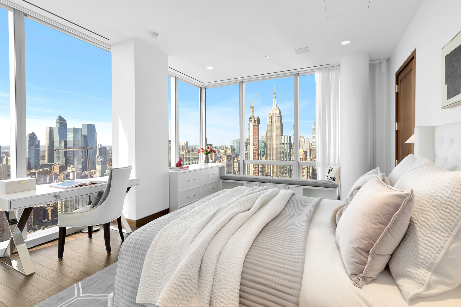 23 East 22nd Street, Unit PH Manhattan, NY 10010 - Photo 12 of 32 a spacious bedroom with a bed and a table