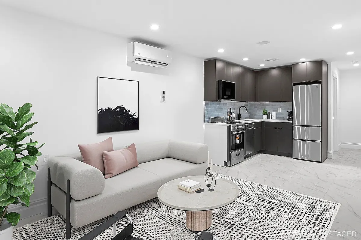 94 Pilling Street, Unit 1 Brooklyn, NY 11207 - Photo 3 of 6 a living room with stainless steel appliances kitchen island granite countertop a sink and a couch