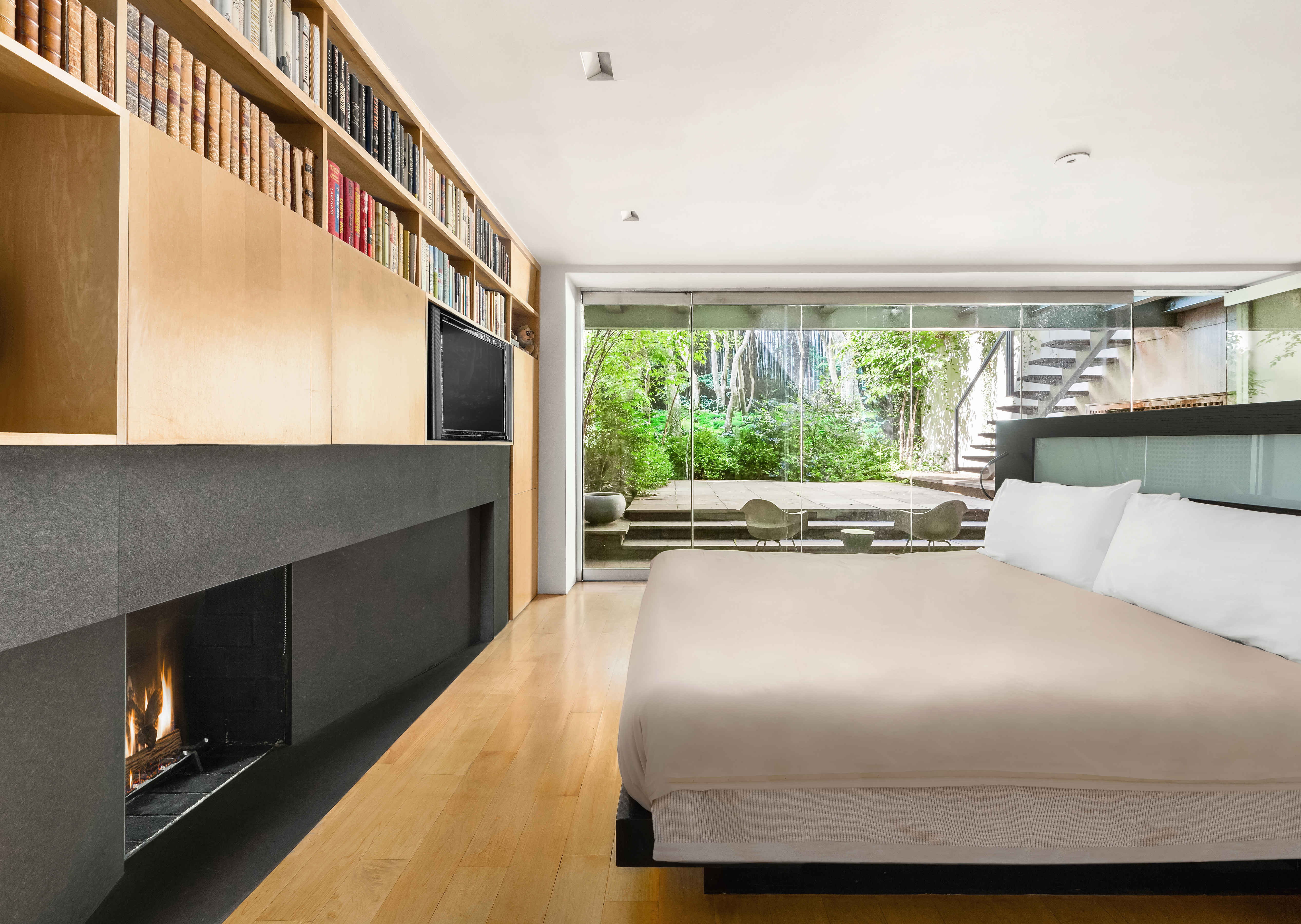 120 East 19th Street Manhattan, NY 10003 - Photo 17 of 33 a living room with furniture and a floor to ceiling window