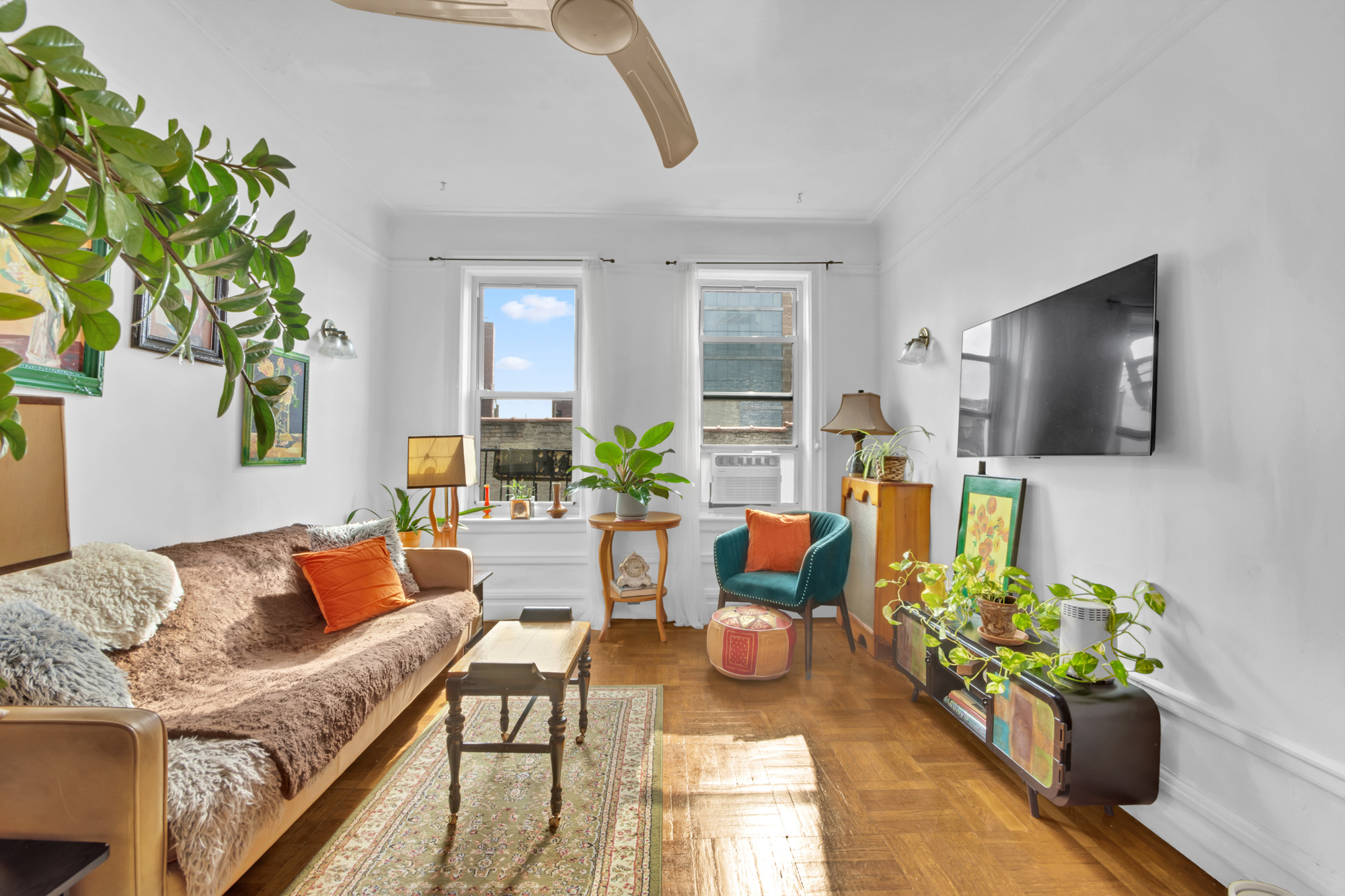 a living room with furniture and a flat screen tv