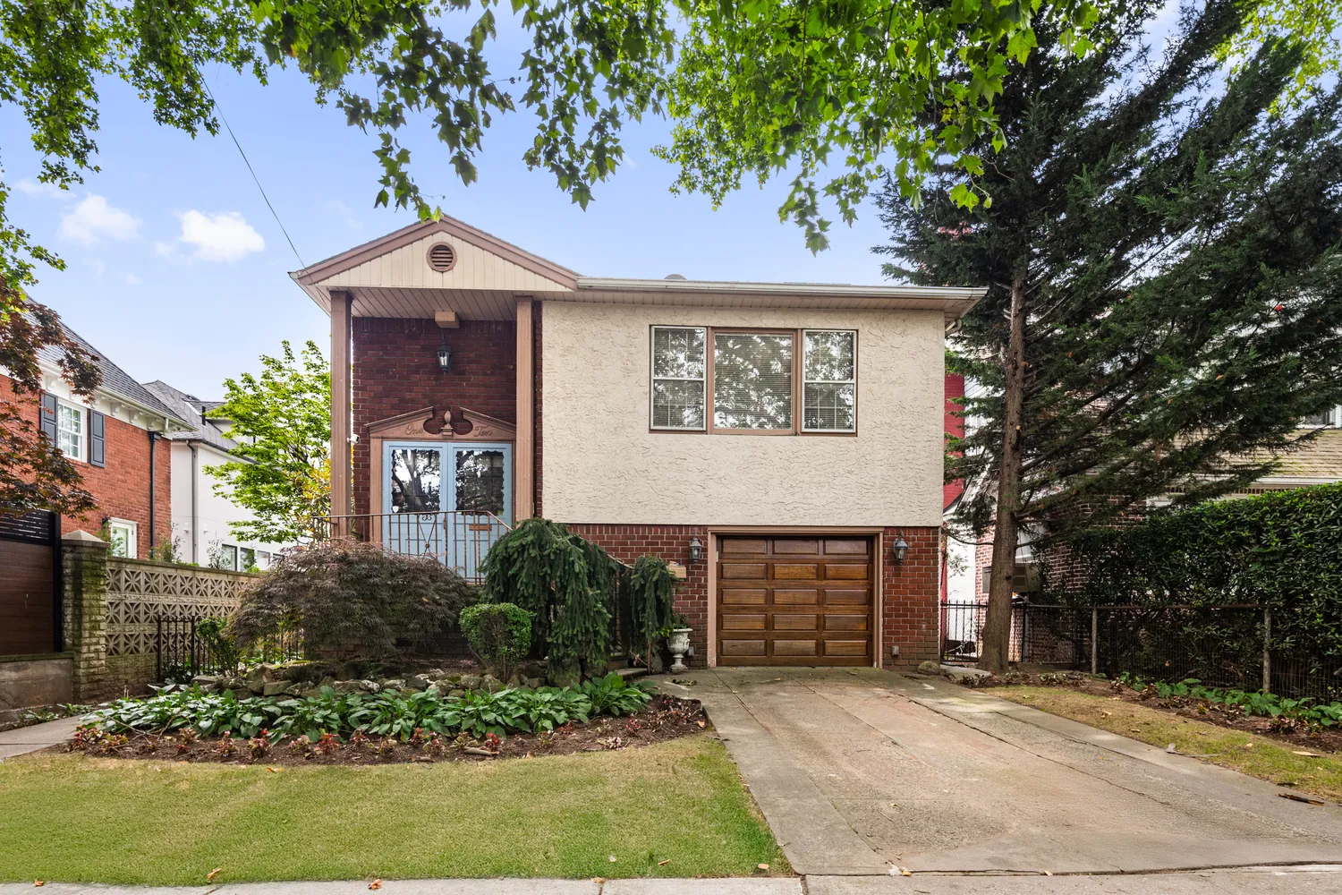 a front view of a house with garden