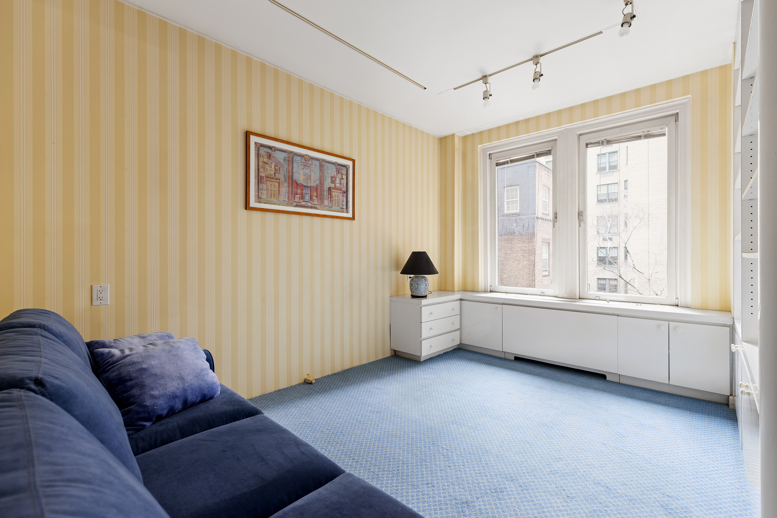 130 East 75th Street, Unit 4D Manhattan, NY 10021 - Photo 10 of 19 a view of livingroom with furniture and windows