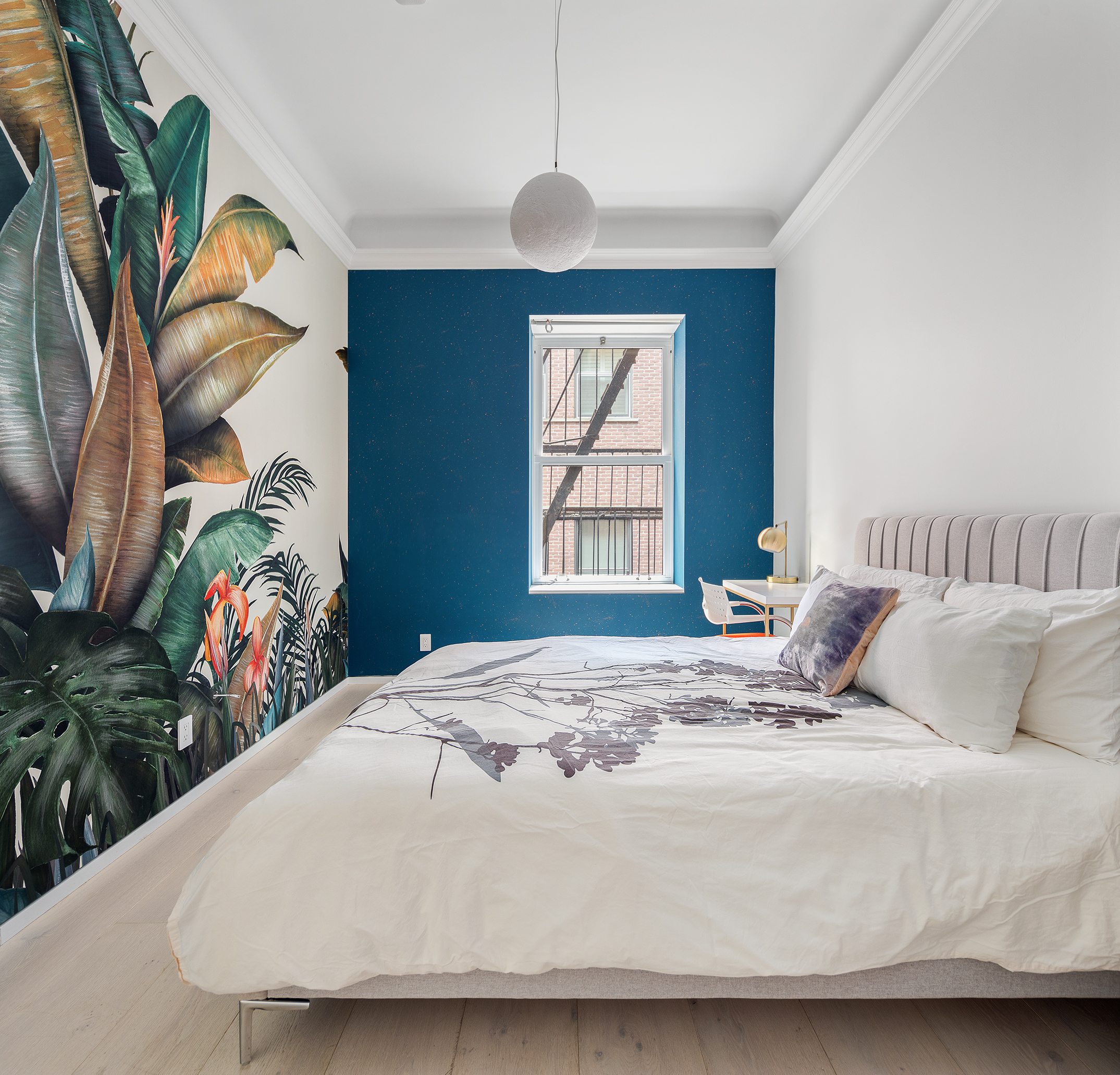 26 West 20th Street, Unit 3 Manhattan, NY 10011 - Photo 10 of 19 a bedroom with a bed and a painting on the wall