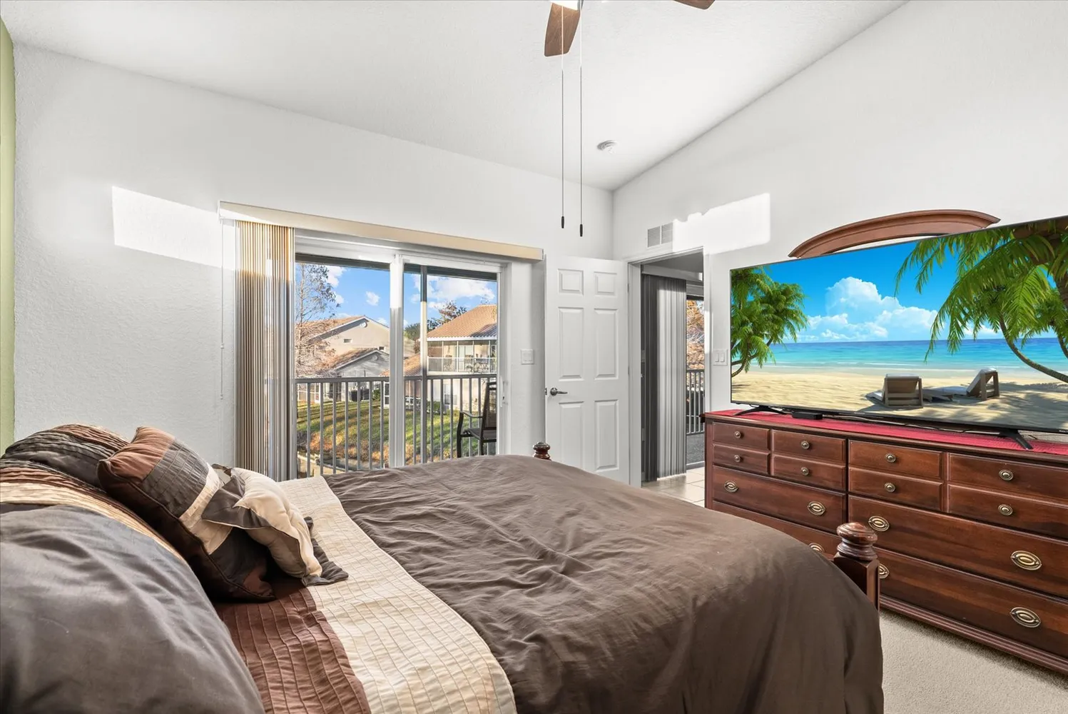 a bedroom with two beds and a chandelier