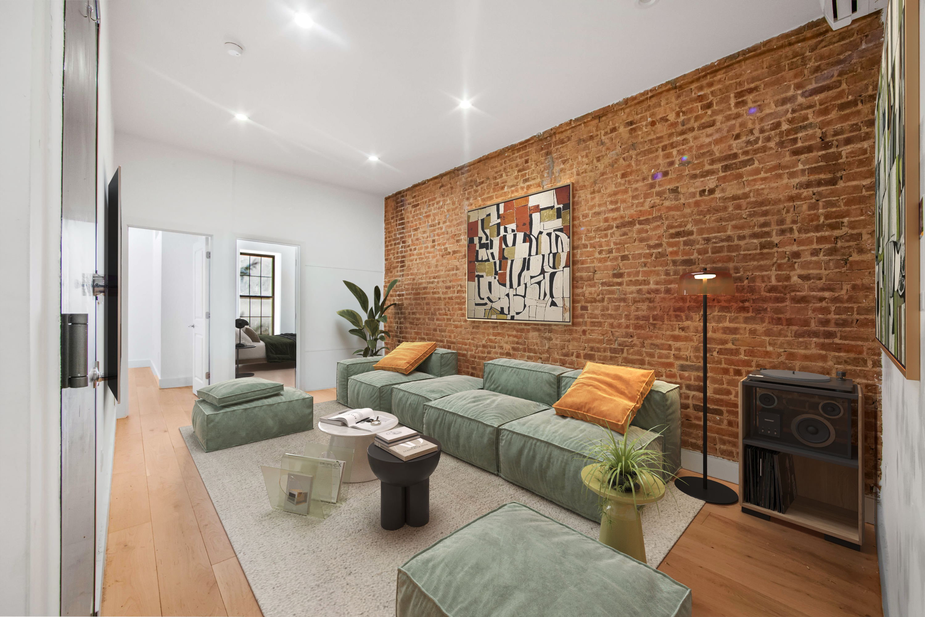 311 East 119th Street, Unit 5 Manhattan, NY 10035 - Photo 2 of 5 a living room with furniture a rug and a fireplace
