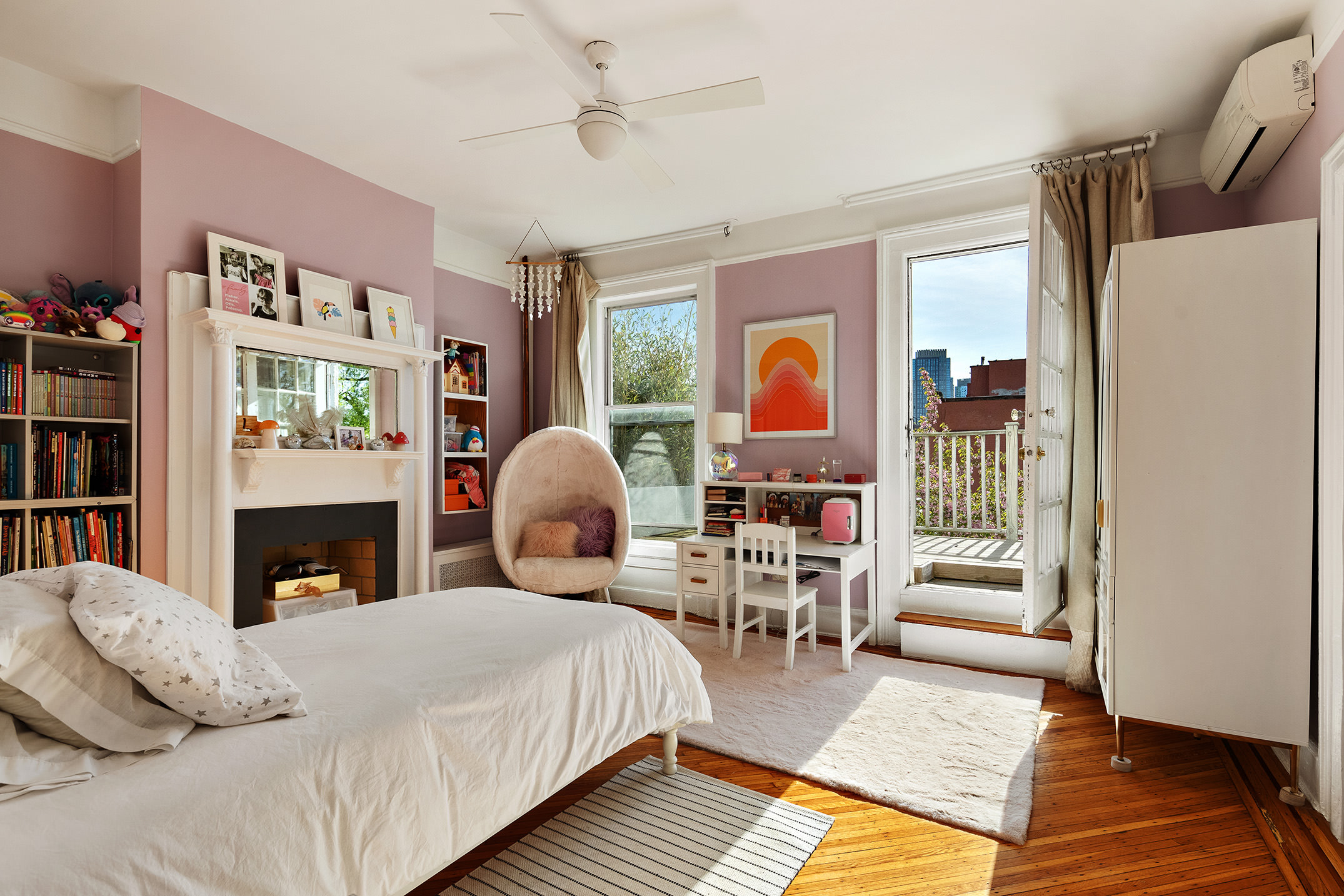 264 Clinton Avenue Brooklyn, NY 11205 - Photo 10 of 21 a bedroom with a bed and wooden floor